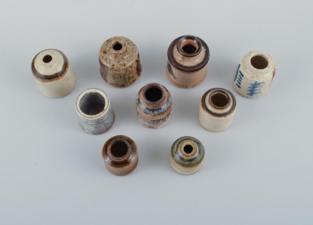 Niels Oluf 'Jeppe' Thorkelin-Eriksen (1926-1981) and Gunver Bilde Sørensen (1931-2018), Denmark. 
Collection of nine miniature vases in glazed ceramics. 1960 / 70's.
In very good condition.
Marked.
Largest measures: H 7,5 x D 7,0 cm.
Provenance: