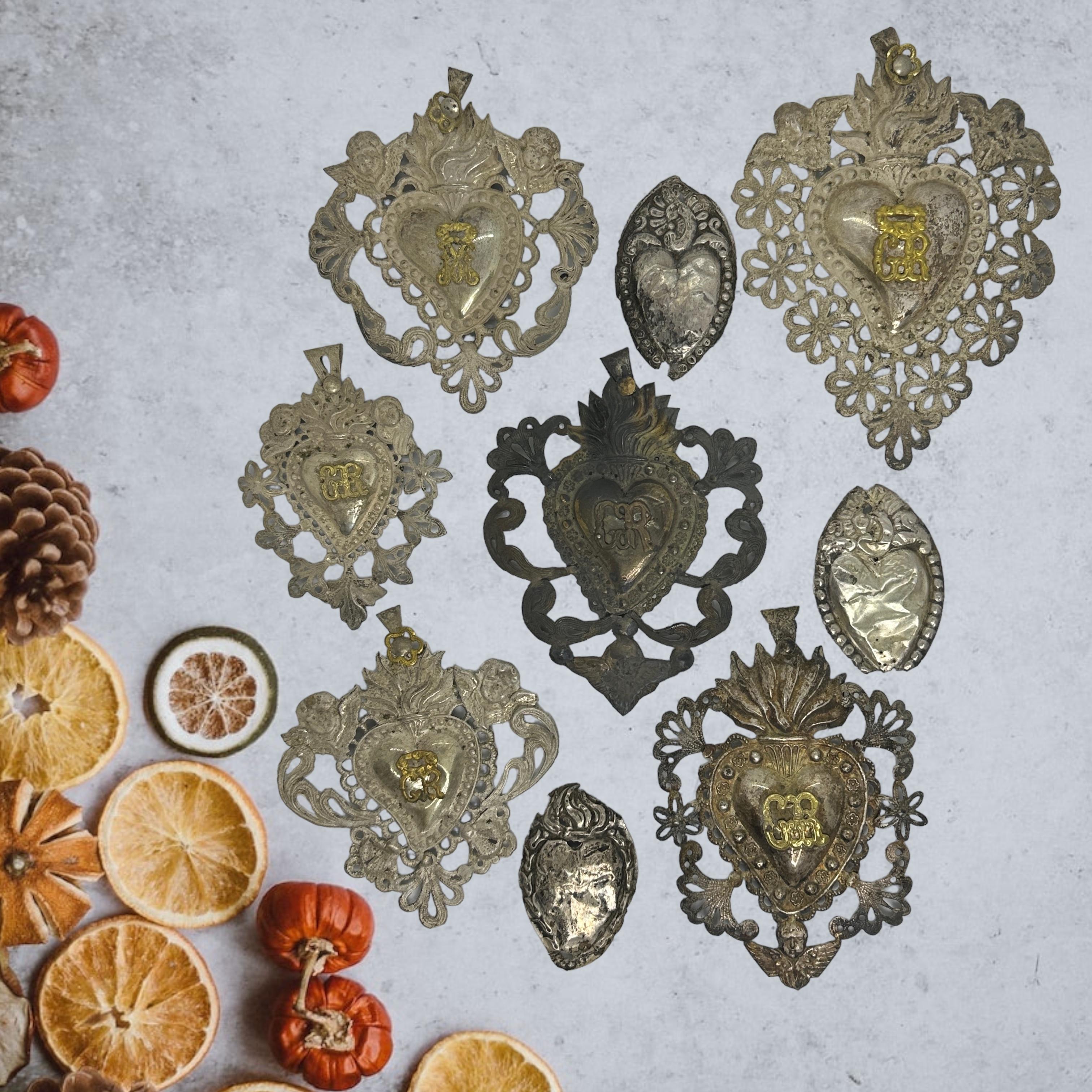 A collection of nine cute petite religious Ex Voto. I do not know what it is made of, thin and light filigree silver or silver plated metal. Each is handmade, embossed and then welded. Given the delicacy, I did not try to remove the tarnish and I