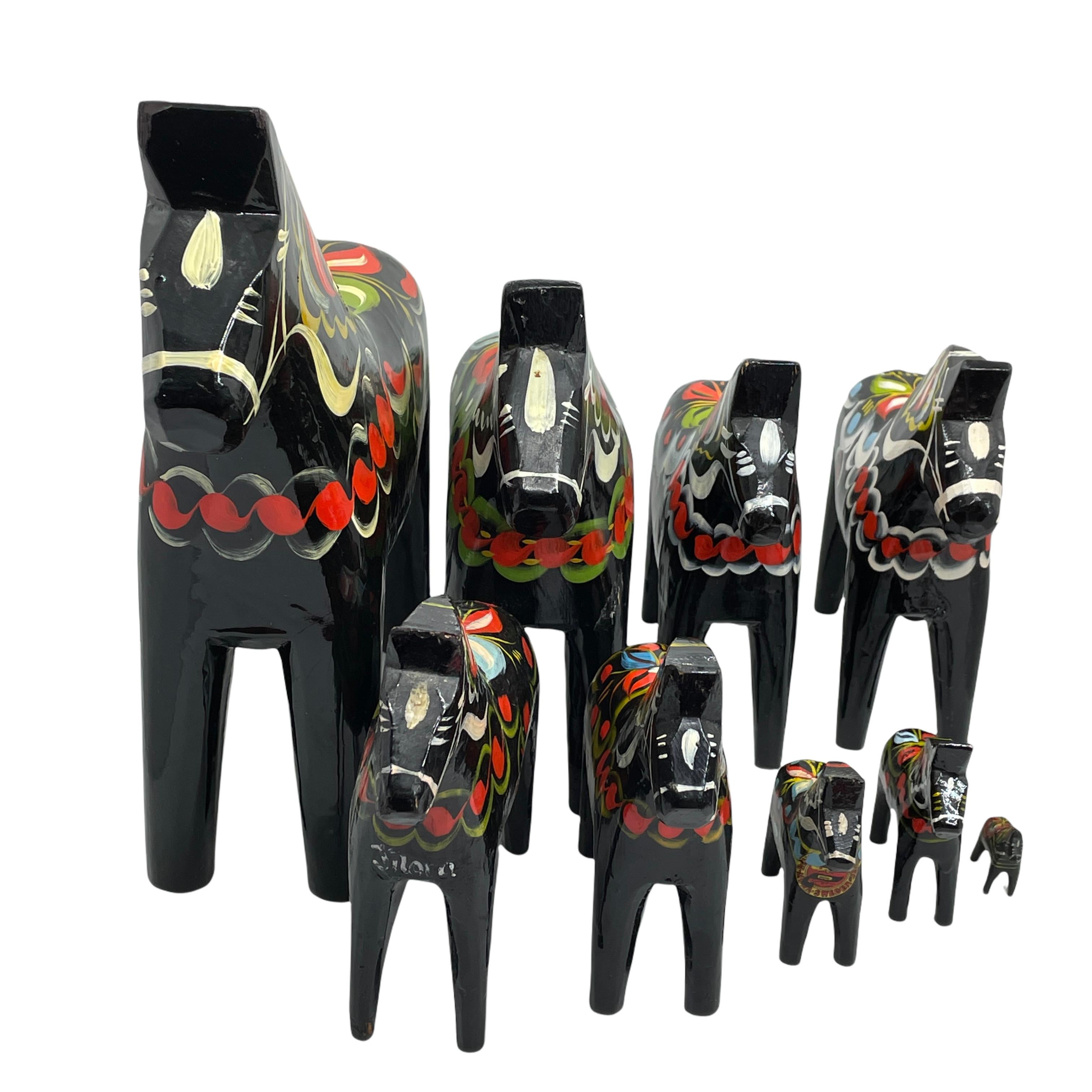 This offer is for a collection of nine Swedish Dala Horses by Nils Olsson. These are hand carved painted wood. The largest one is approximate 10 1/2