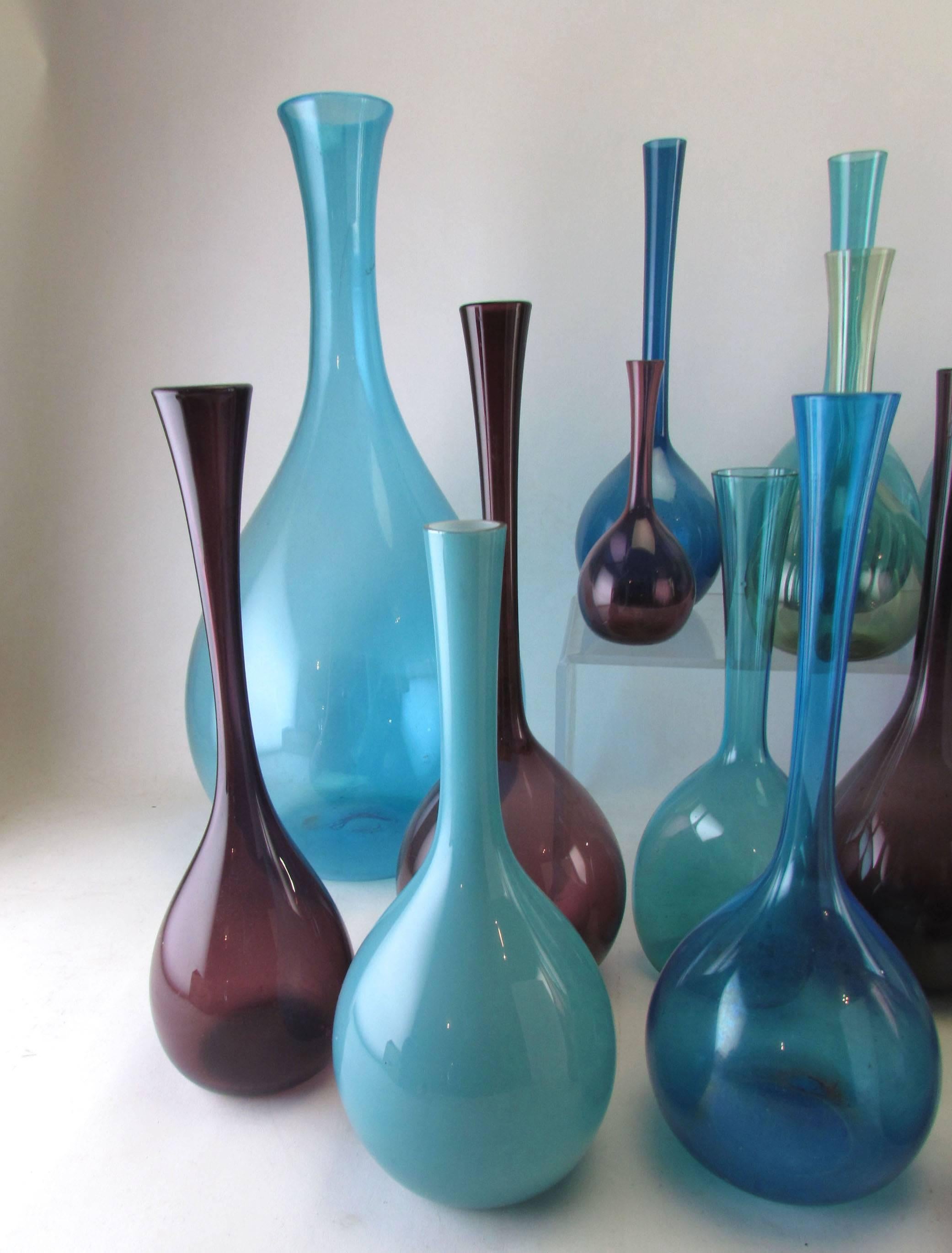 Collection of 19 midcentury Swedish blown glass vases in various sizes and colors. By various makers, some by Arthur Percy for Gullaskruf, Aseda, etc.

Tallest vase (deep blue cobalt) measures 19.5