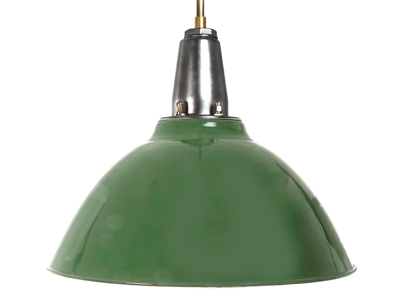 This was an amazing barn find. These lamp domes are in a green over an antique white porcelain finish. The 20 inch diameter dome is impressive and the condition is beautiful. The shade holder is bright steel and brass. The lamp is also signed