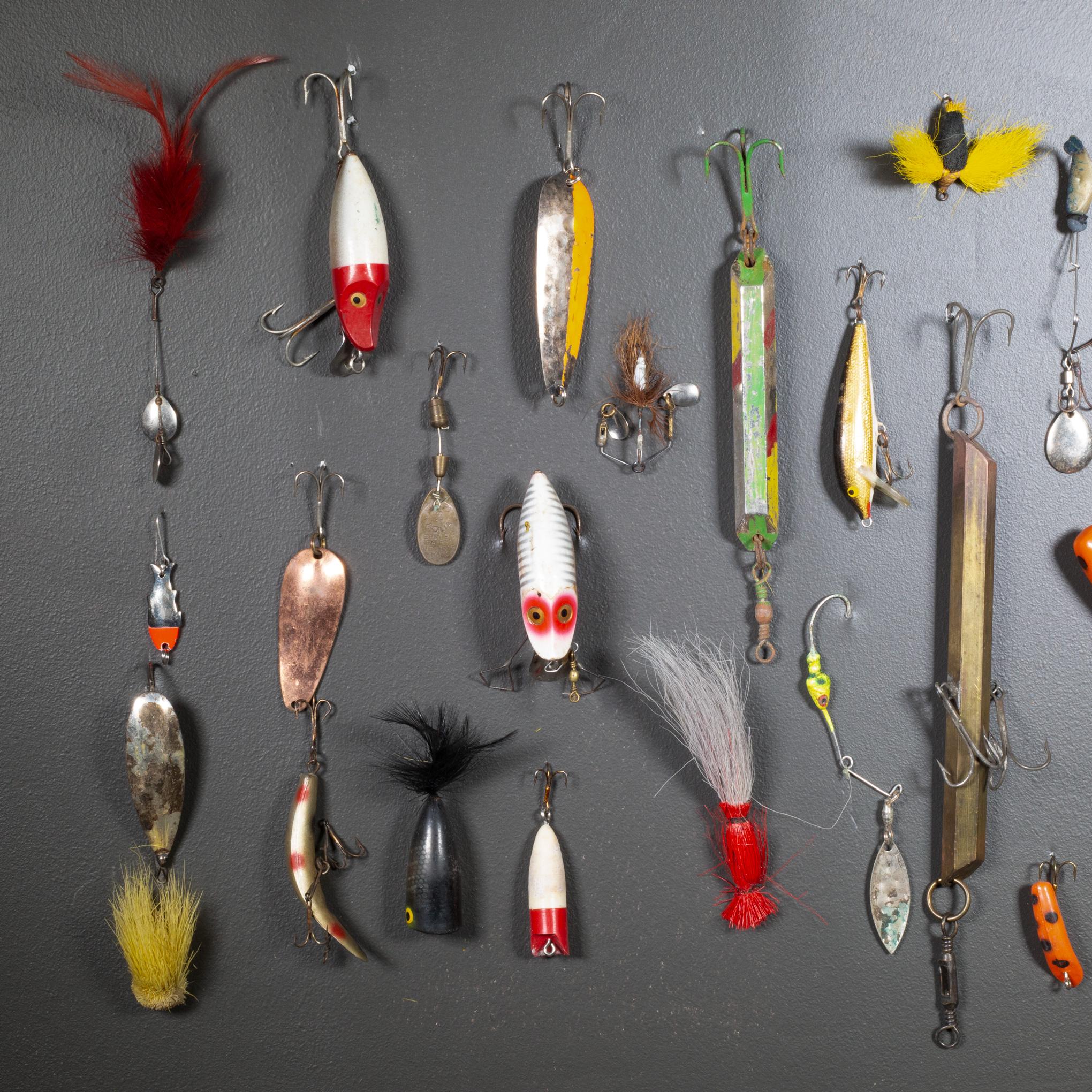 ABOUT

A collection of 39 painted wooden and metal fishing lures with metal hooks. Two large lures are steel. 

Unframed. Shown with life size hand model for scale. 

    CREATOR Unknown.
    DATE OF MANUFACTURE c.1940-1950s.
    MATERIALS AND