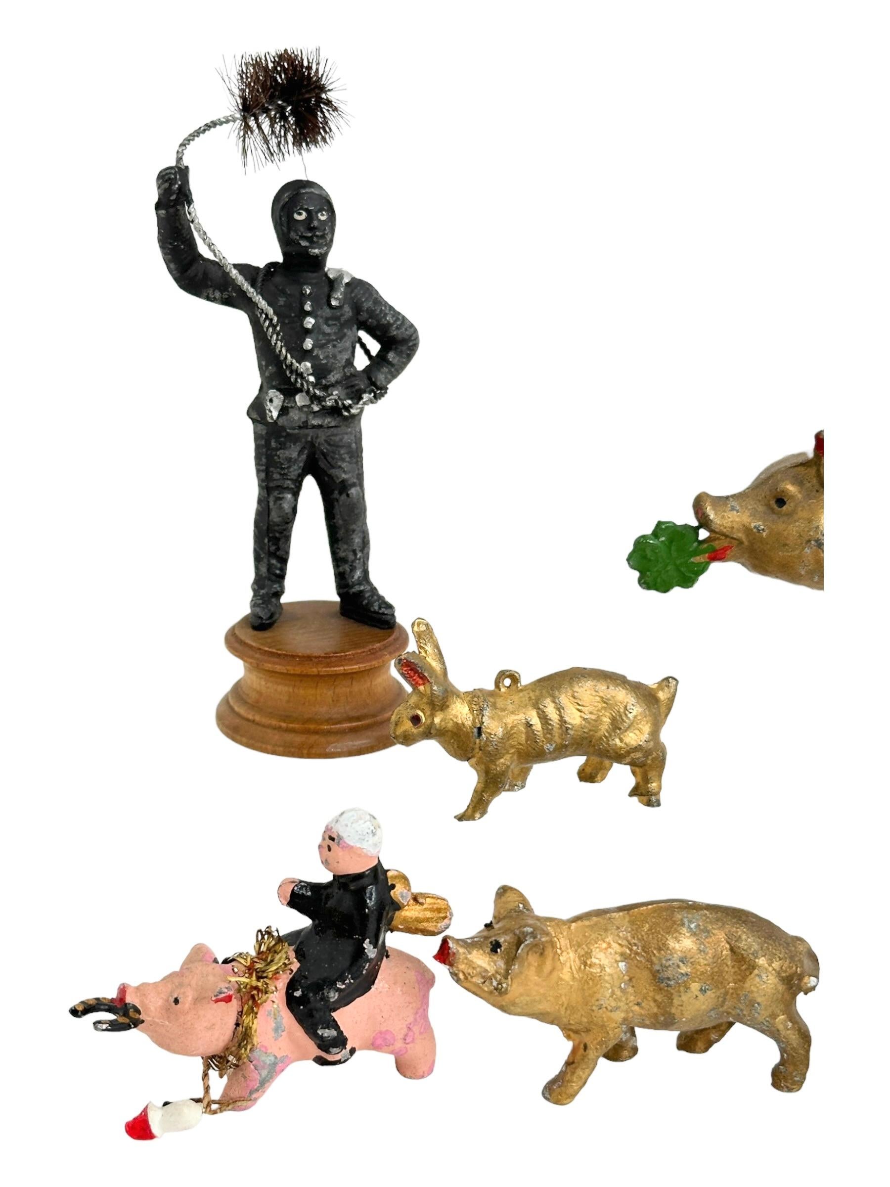 A beautiful collection of golden rabbit, pig and Chimney Sweep lucky charm figurines. Made from white metal, pewter or composition (putz) and hand painted with cold paint like the bronze Vienna miniatures. Such items are given away as good luck