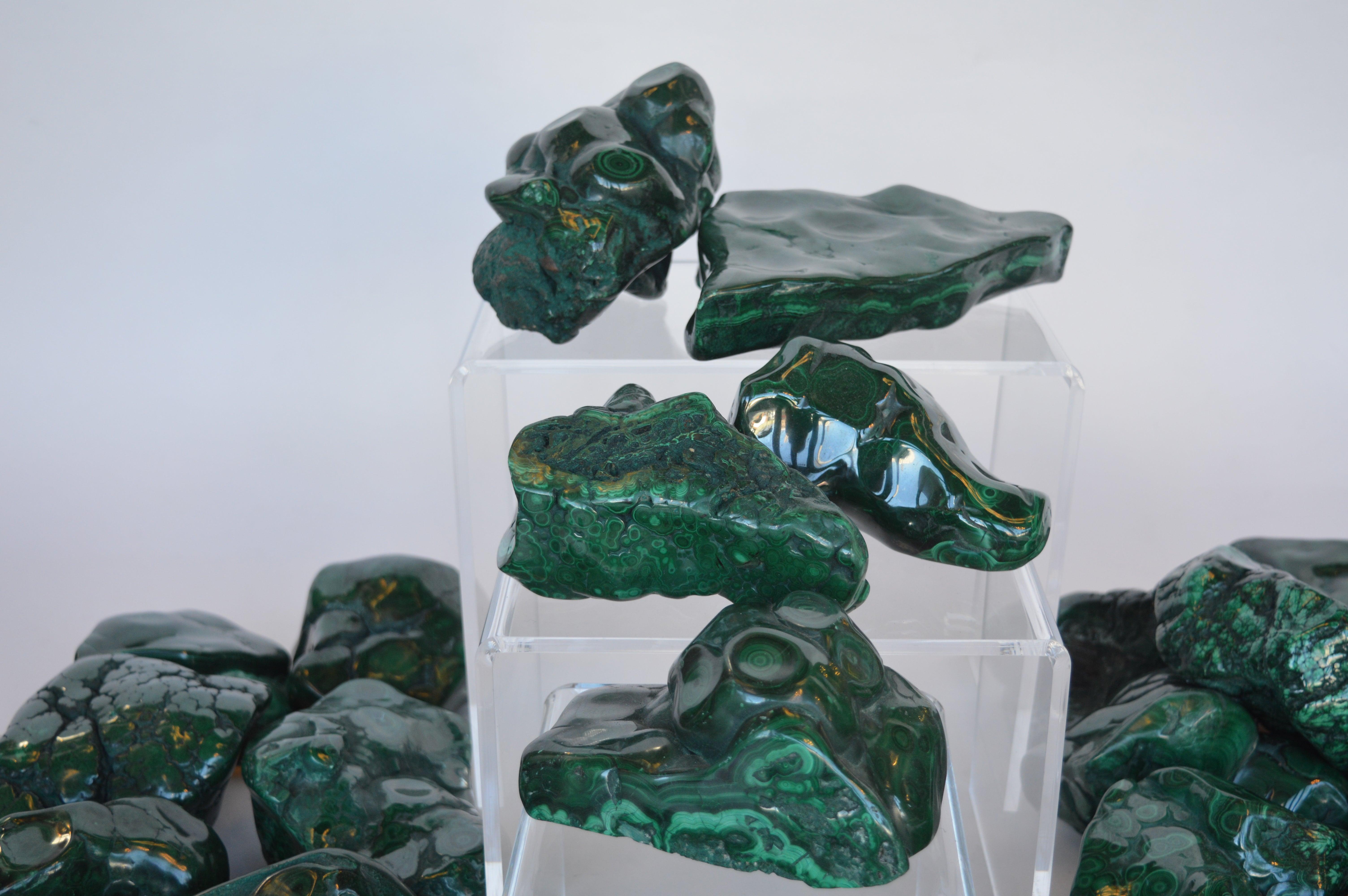 Collection of many Malachite stones, all polished.
Sizes and shapes all very and unique.