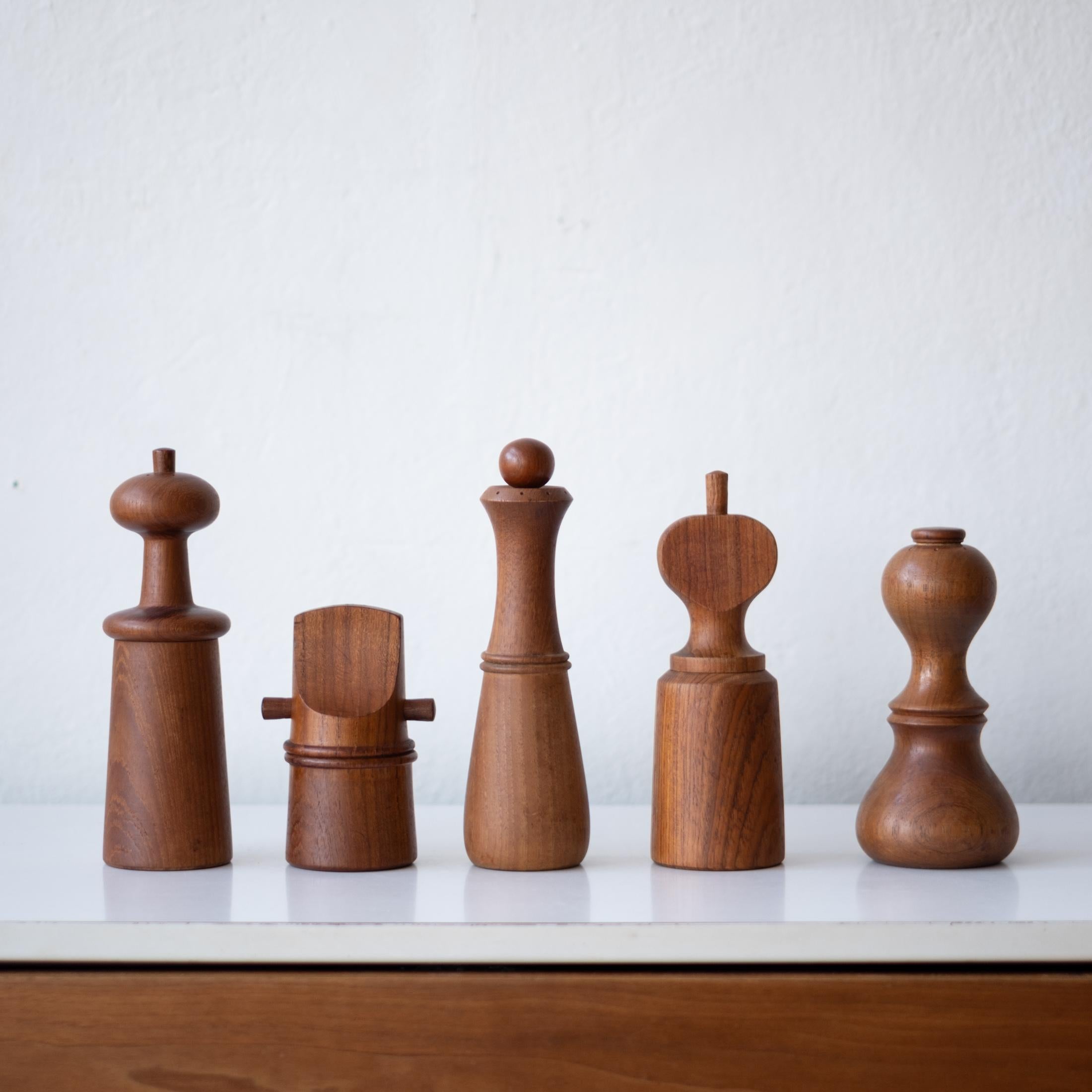 Collection of five teak pepper mills by Jens Quistgaard. All mills were produced by Dansk in Denmark. circa 1960s.