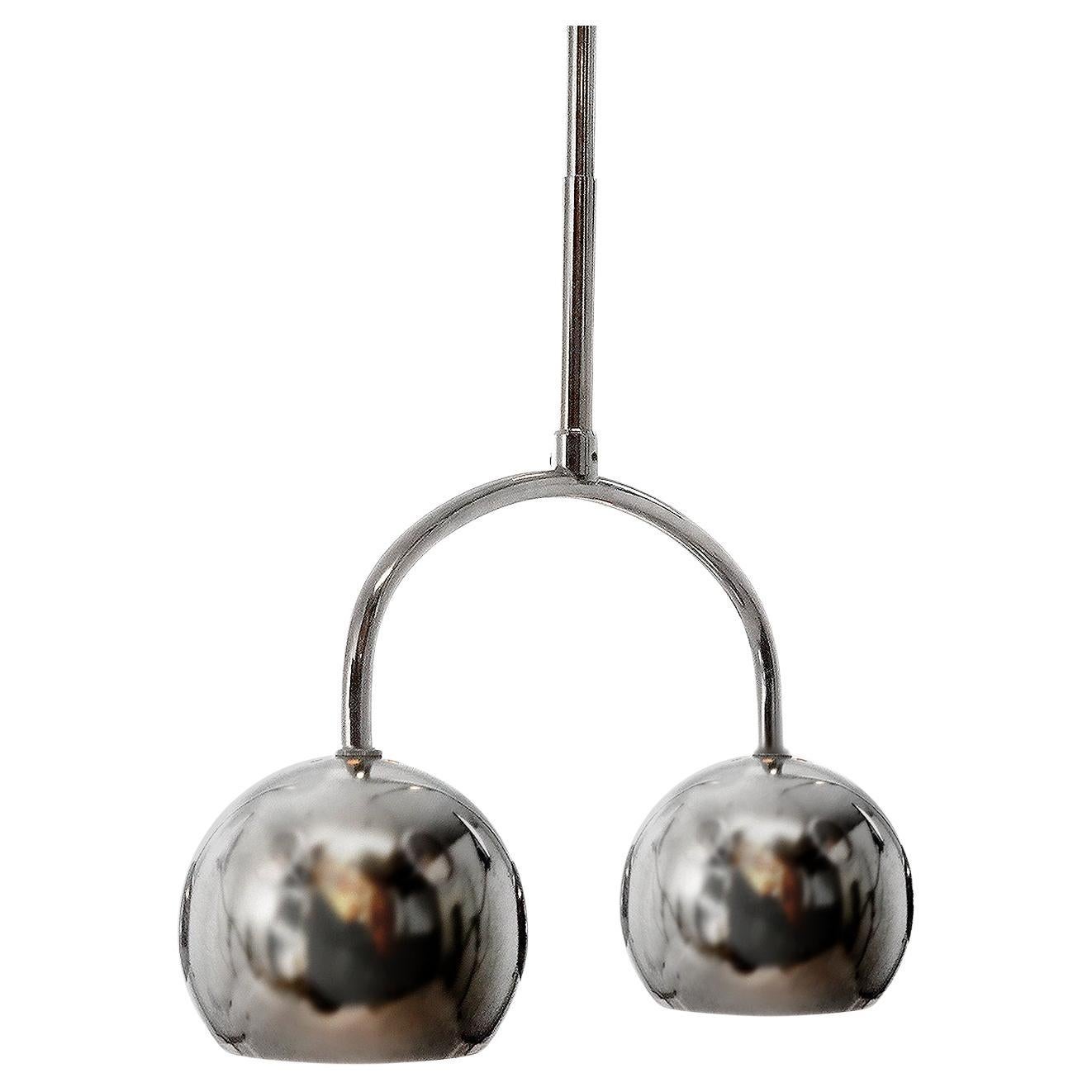 We have a small collection of these rarely seen Robert Sonneman double pendents. They are priced per pendent so you can buy just one or the collection. The lamp features 2 perforated 5 inch chrome plated globes in a wishbone frame. Each sphere takes