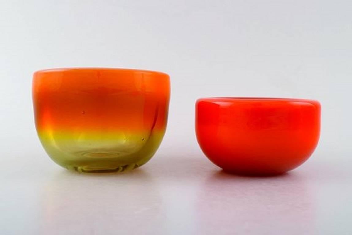 orange glass vases and bowls