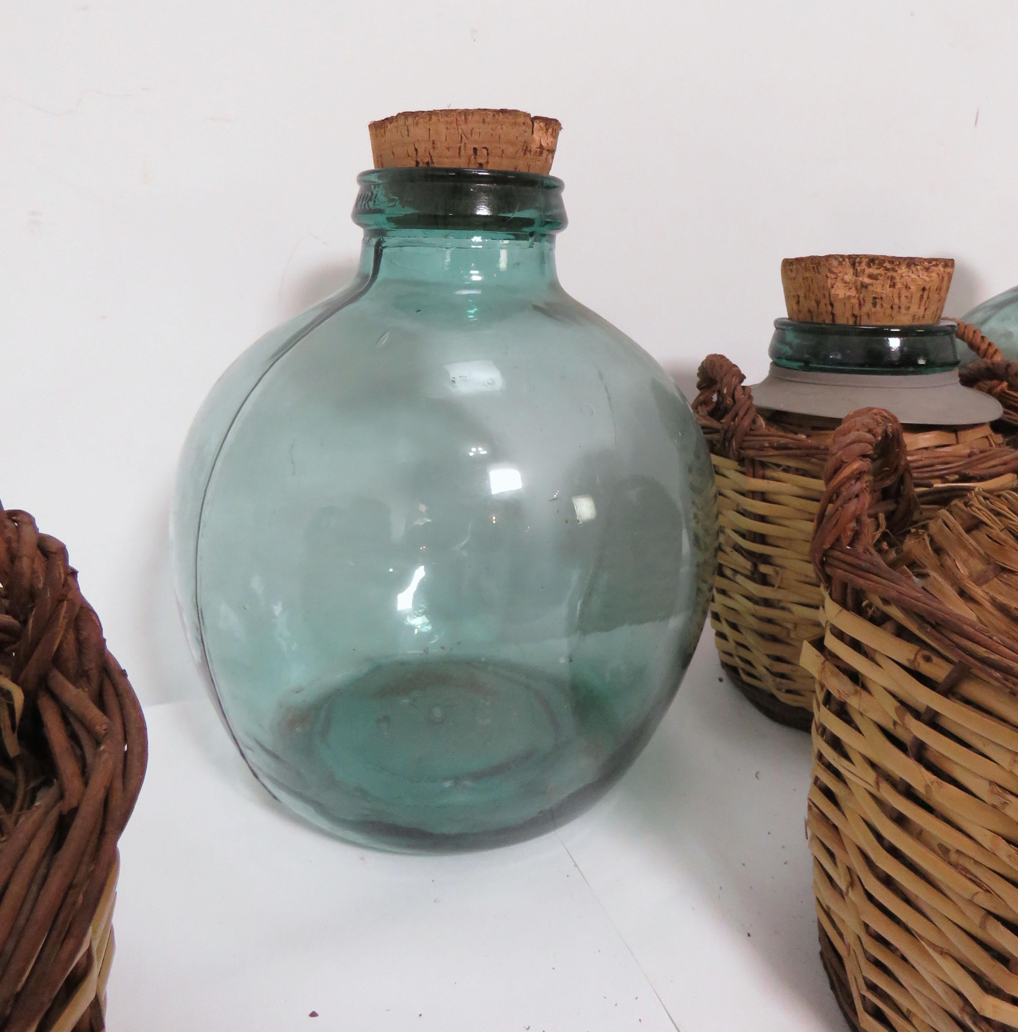 Rattan Collection of Seven Antique French Demijohn Carboy Bottles, circa 1930s-1940s
