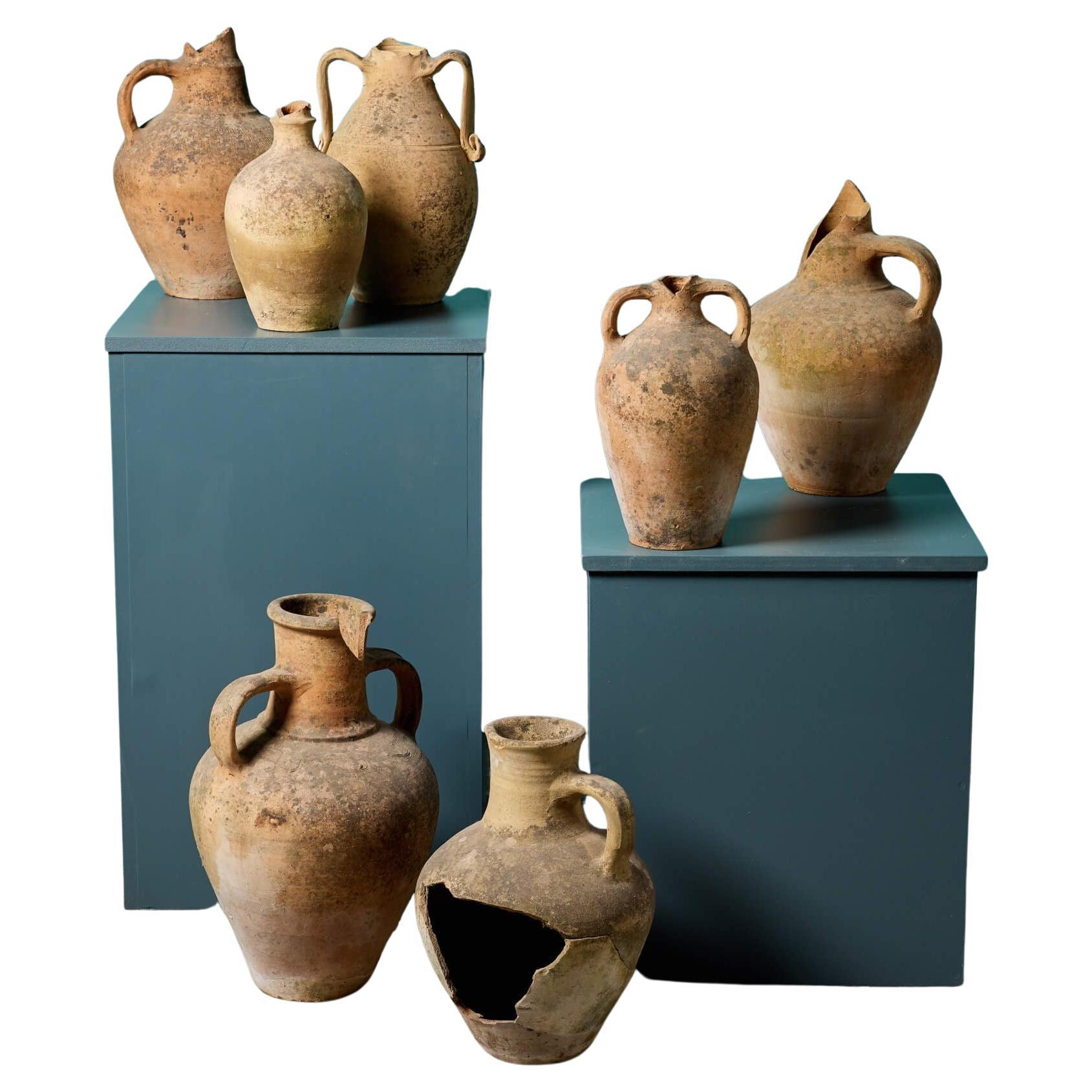 Collection of Seven Mediterranean Terracotta Storage Jars For Sale