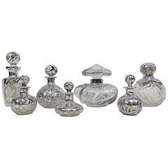 Collection of Seven Perfume Bottles circa 1890s Silver Overlay on Glass Baccarat