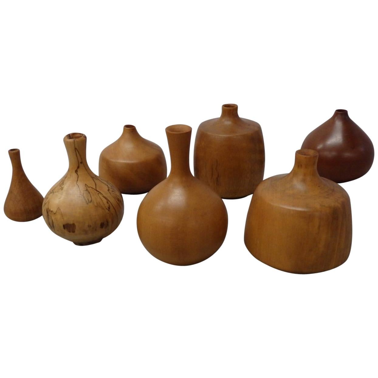 Collection of Seven Rude Osolnik Various Turned Wood Weed Pots