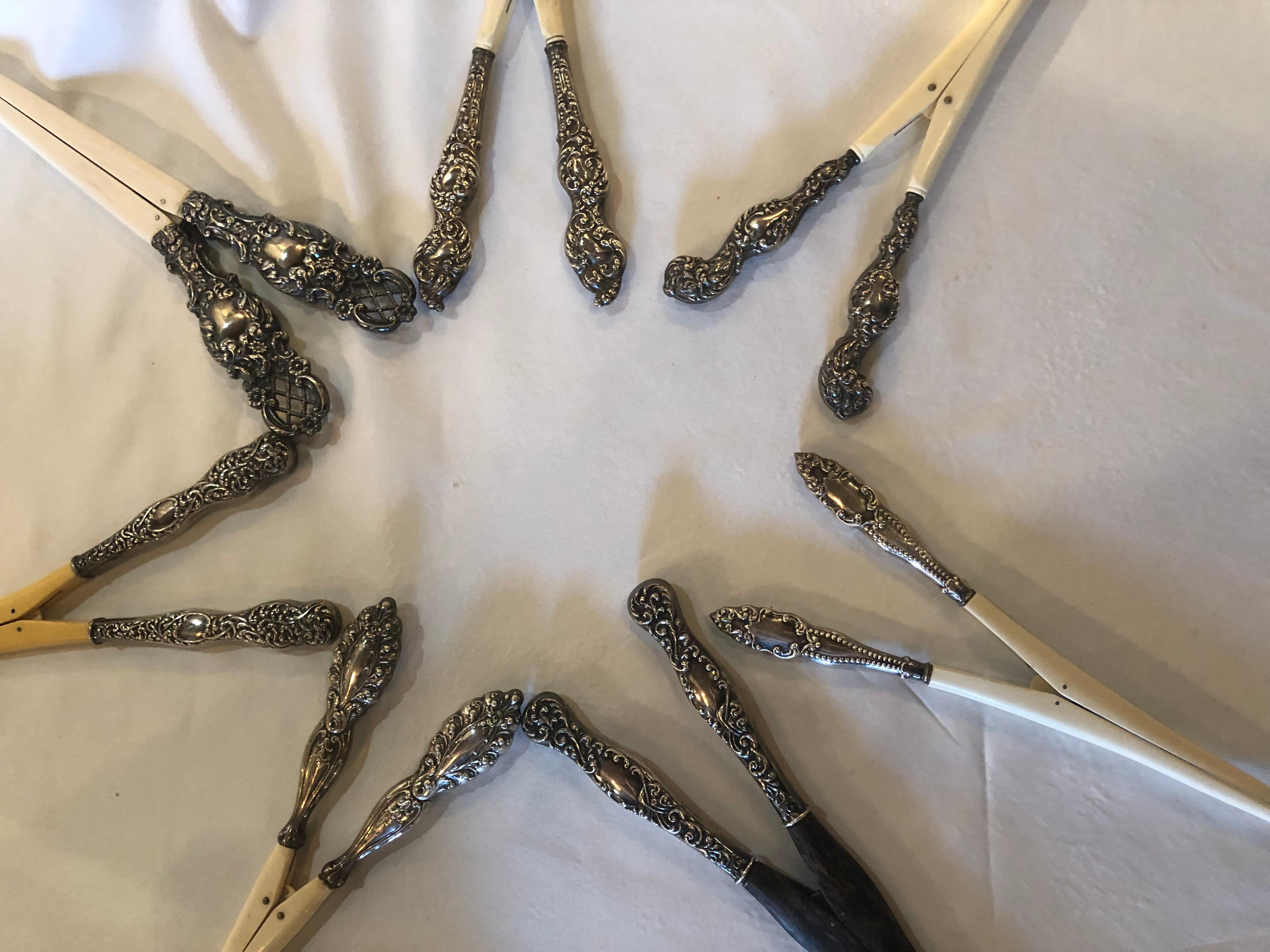 Collection of seven sterling handled antique glove stretchers. The largest at 9 inches, the smallest at 7.50 inches. Each having spring action with what appears to be bone clips.
