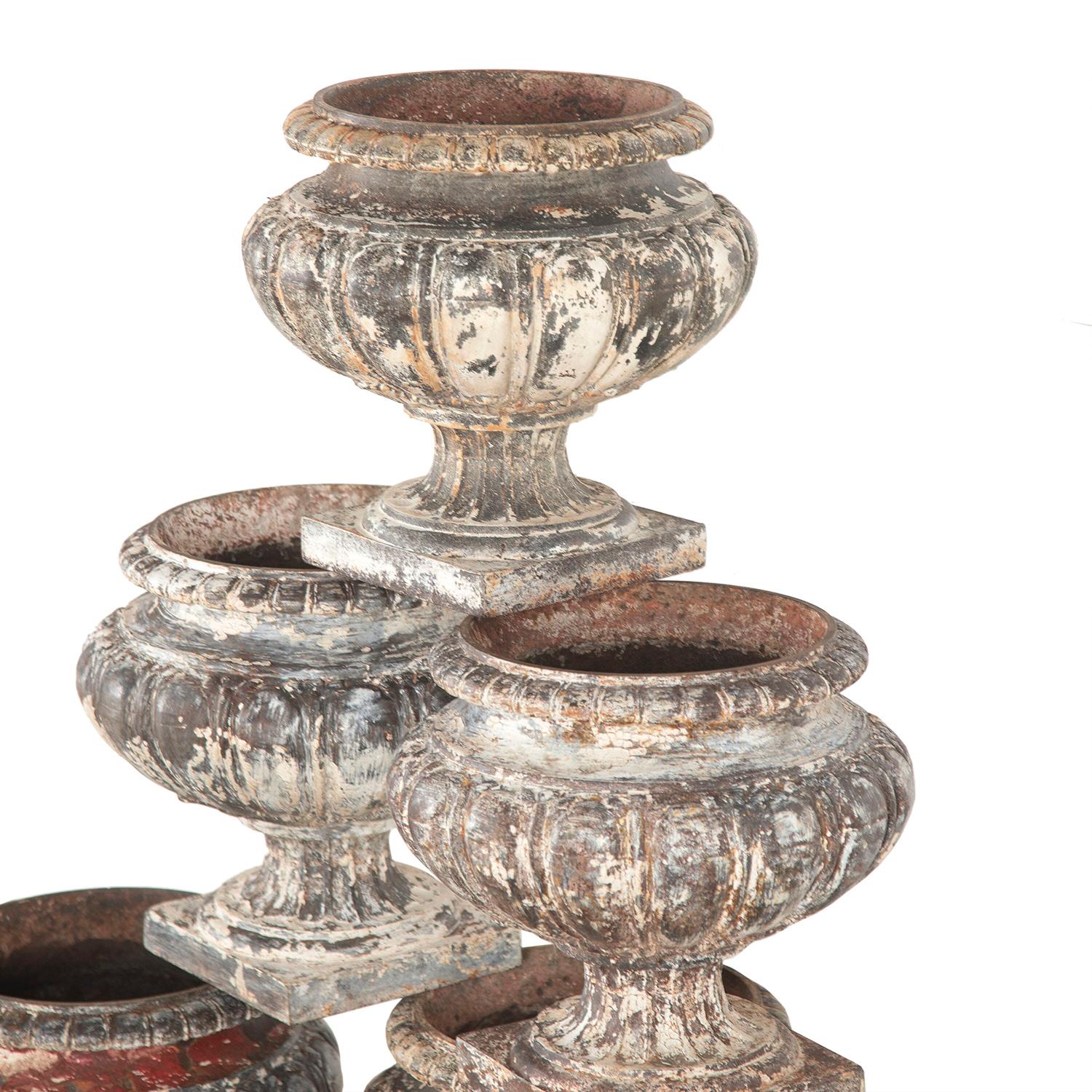 Wonderful collection of six 19th century urns from the South of France. 
These charming urns all have a pumpkin shape and decorative moulded details. They have all weathered and worn beautifully, with varying patinas. 
Grouped together as a set or