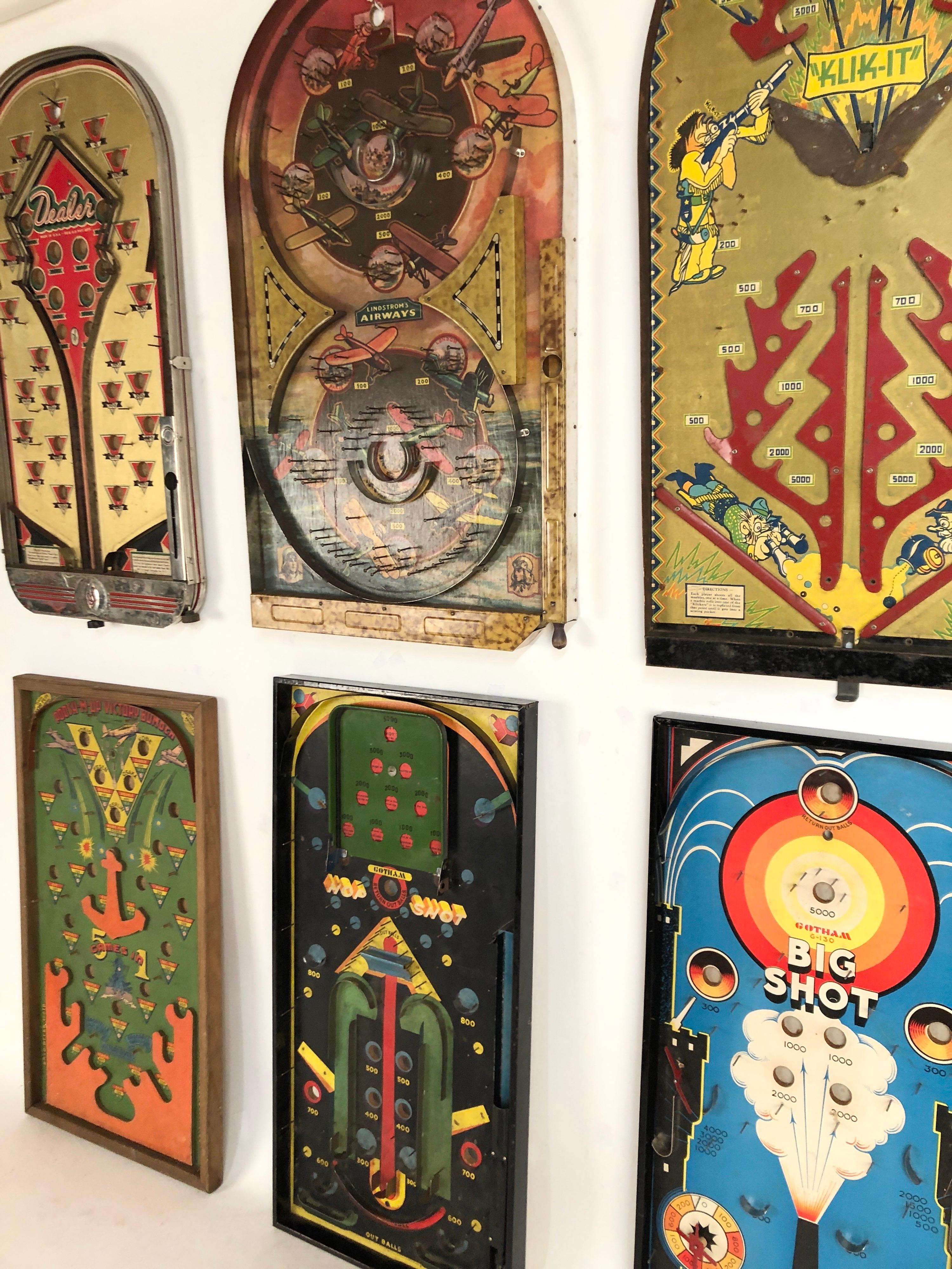 A collection of 6 colorful antique tabletop pinball games, circa late 1920s-1940s. Great graphic display. Wonderful colors. Easily hung.