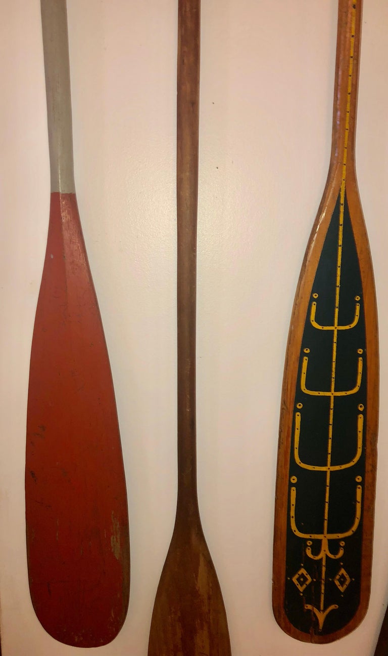 collection of six antique wooden canoe paddles with