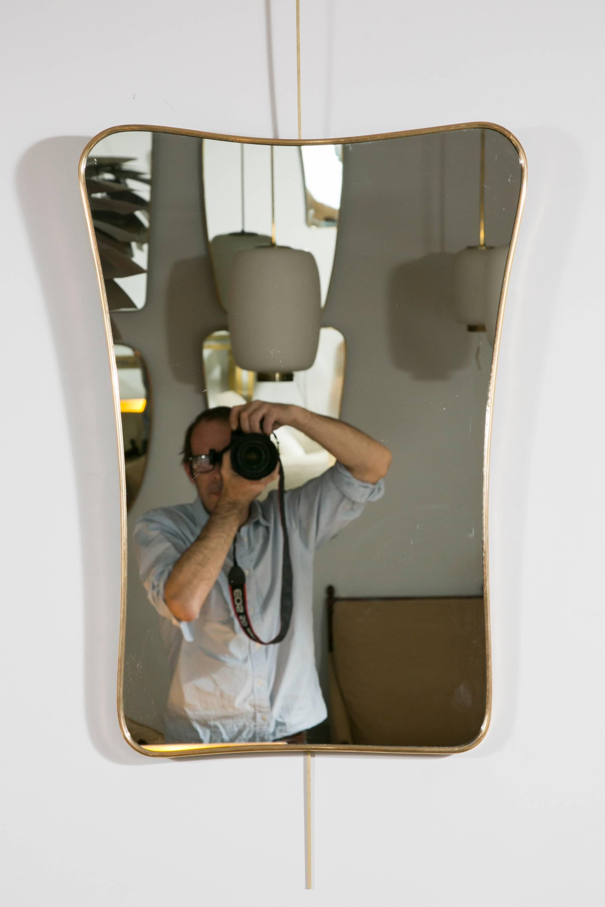 A collection of six wall mirrors, brass frames, various size and shapes in the style of Gio Ponti, 
Italy, circa 1955. 

Dimensions on top left to right:
H : 72 cm (28.3 in.) – L (W) : 51 cm (20.1 in.)
H : 77 cm (30.3 in.) – L (W): 51.5 cm