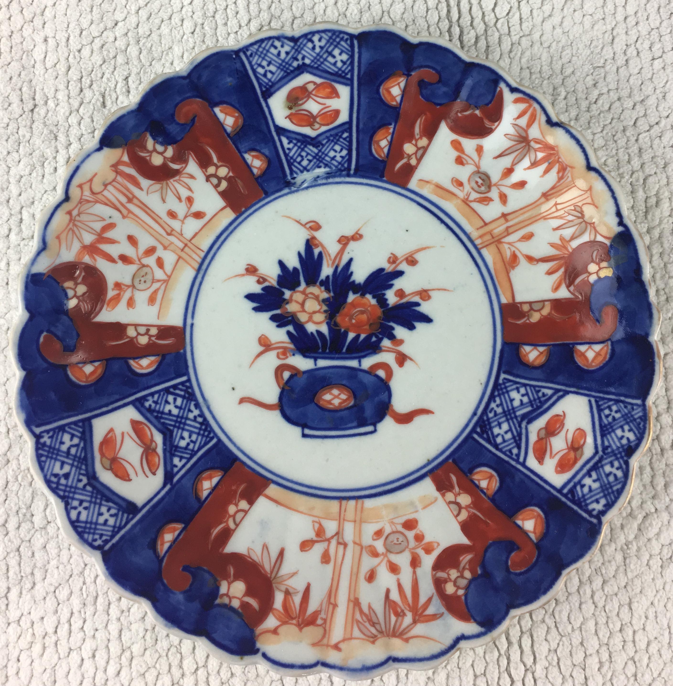 A stunning collection of six (priced individually) Meiji period petal shaped Imari plates in the very best of condition. With an overall floral decoration in blue, orange and green colors. The base has a basket of flowers in the centre section. It