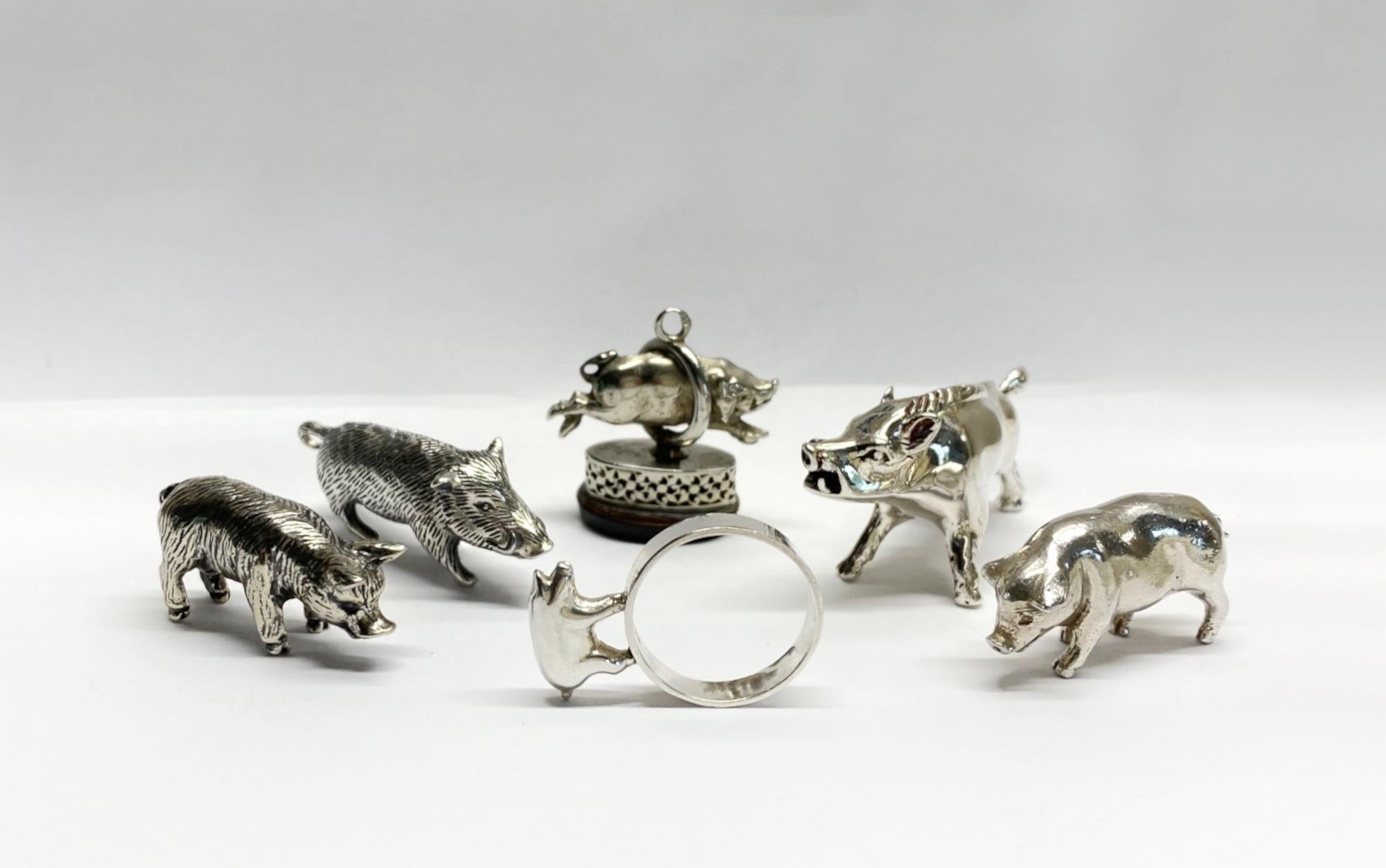 Collection of Six Miniature Silver Pigs & Wild Boar 

A delightful collection of six miniature pigs and wild boar in solid silver with some lovely detail. 

The set was sourced in south west France and the total weight of silver is 97 grams. 

Pig