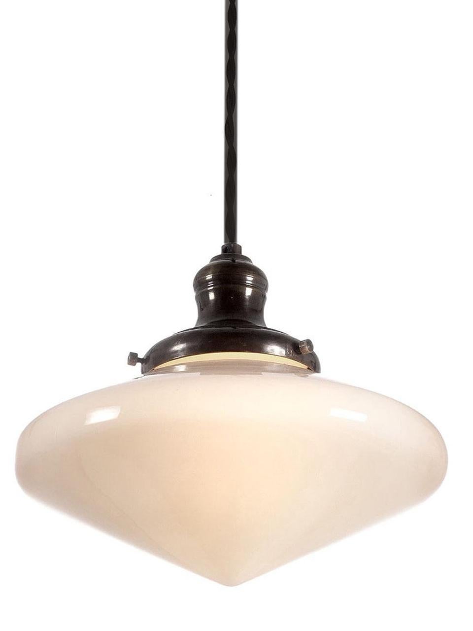 The look is both Art Deco and midcentury. What I like about these shades are the very useable size. The diameter is only 9.75 inches. It is white milk glass and the shade takes on the hue of the bulb used. It gives a nice pleasing glow with no