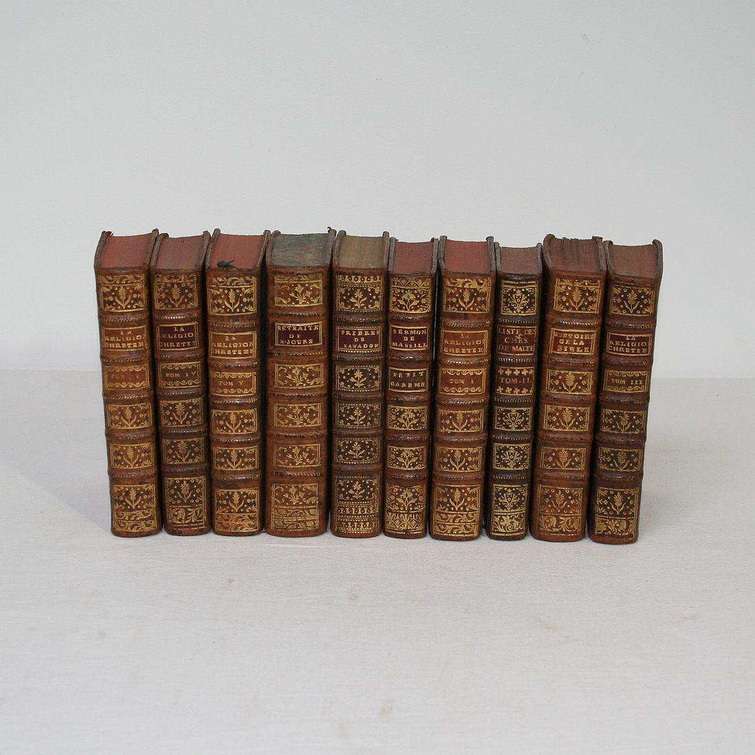 Great collection of ten leather books, France, 18th century. Weathered. Measured as a group.