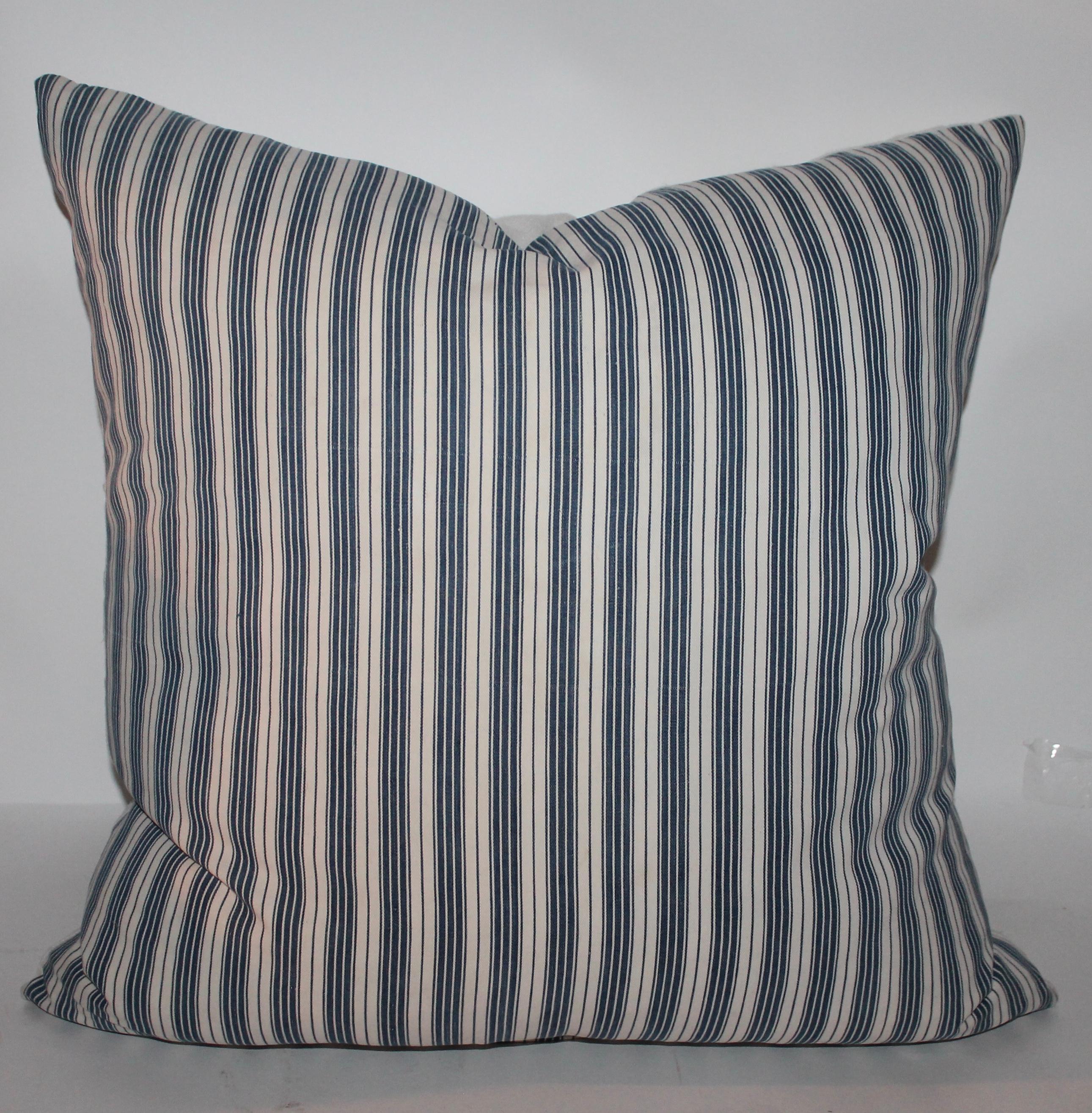 Were selling one pair and one large amazing 19th century blue and white ticking pillows with white linen homespun backings. All are down & feather fill.

Small pillows measure 20 x 20 -2
Large ticking pillow 22 x 22-1
 Selling the group as one