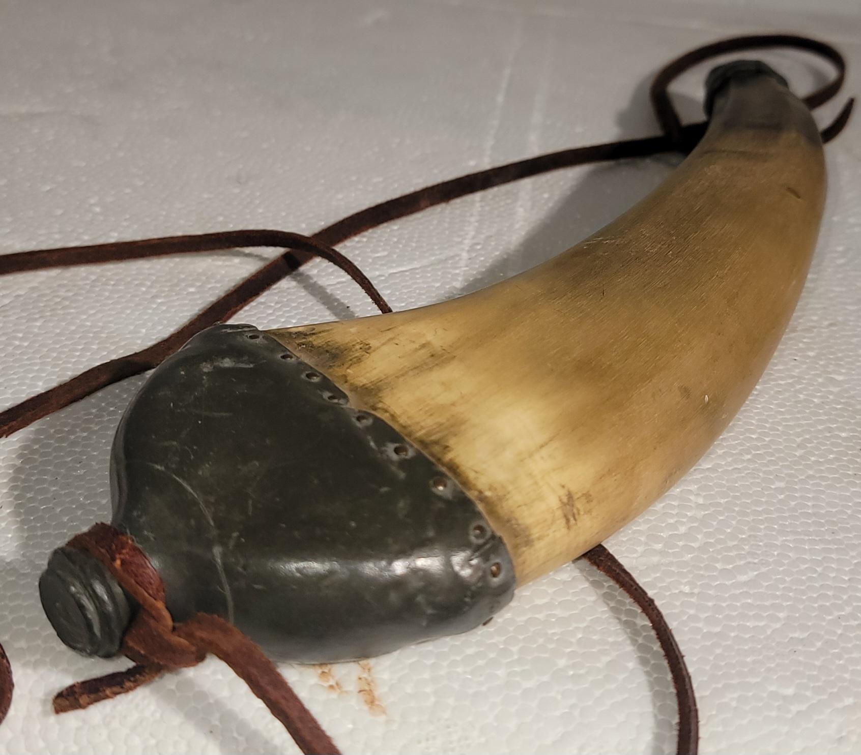 This collection of hand carved & hand crafted antler powder horns on leather stands.These horns were used to store gun powder and a lot of times hand made by the cowboys or American Indians used in hunting.Great western style.Sold as a group of