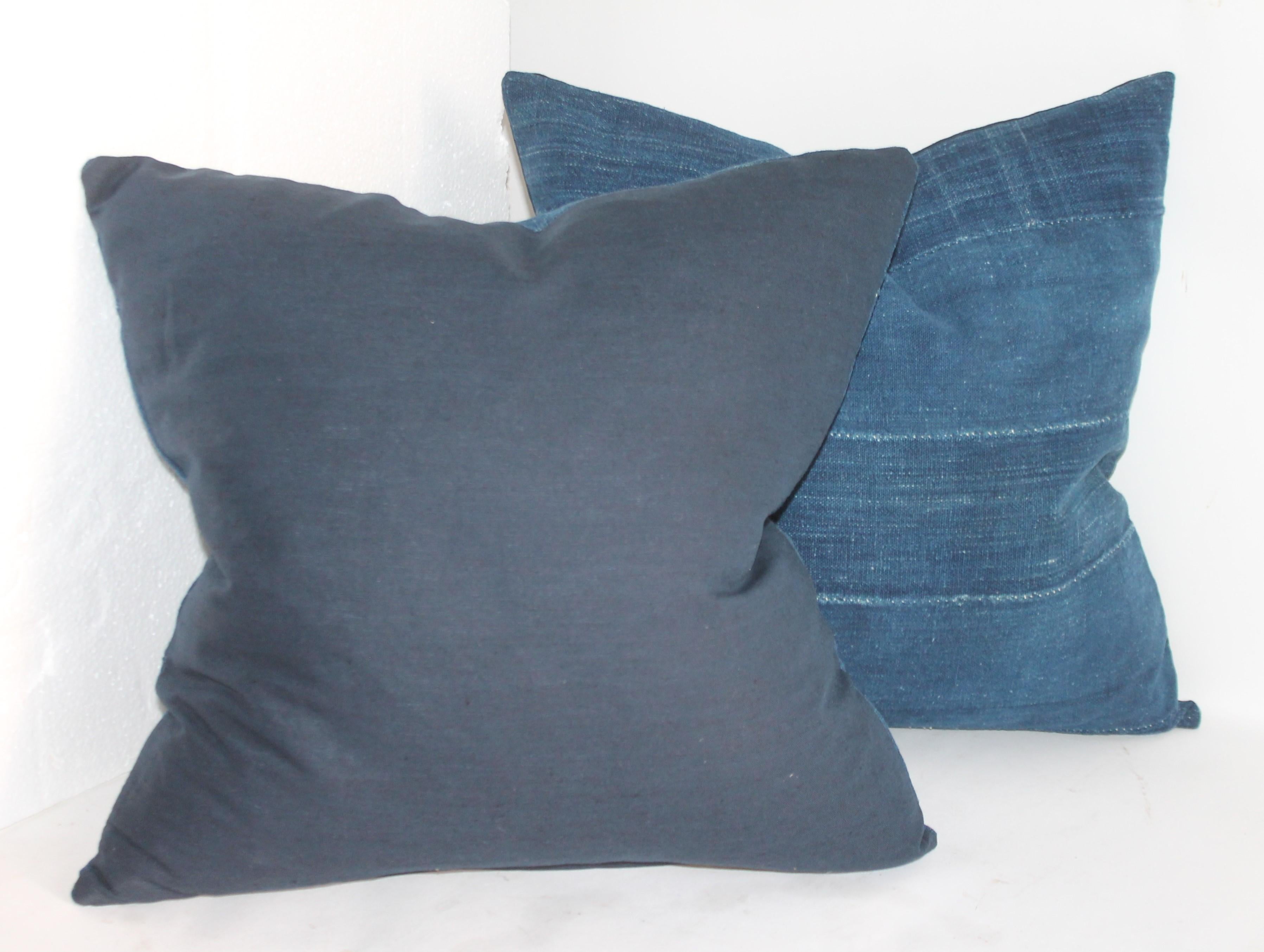 Collection of three indigo blue homespun linen pillows. The backings are in indigo blue linen and down and feather fill. Selling as a group of three.