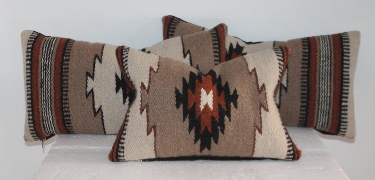 This group of three Mexican Indian weaving pillows are in fine condition and all have dark cotton linen backings. The inserts are down and feather fill.

larger pillows measure - 
17 x 9.5
Smaller pillow measure -
13 x 9.5.
