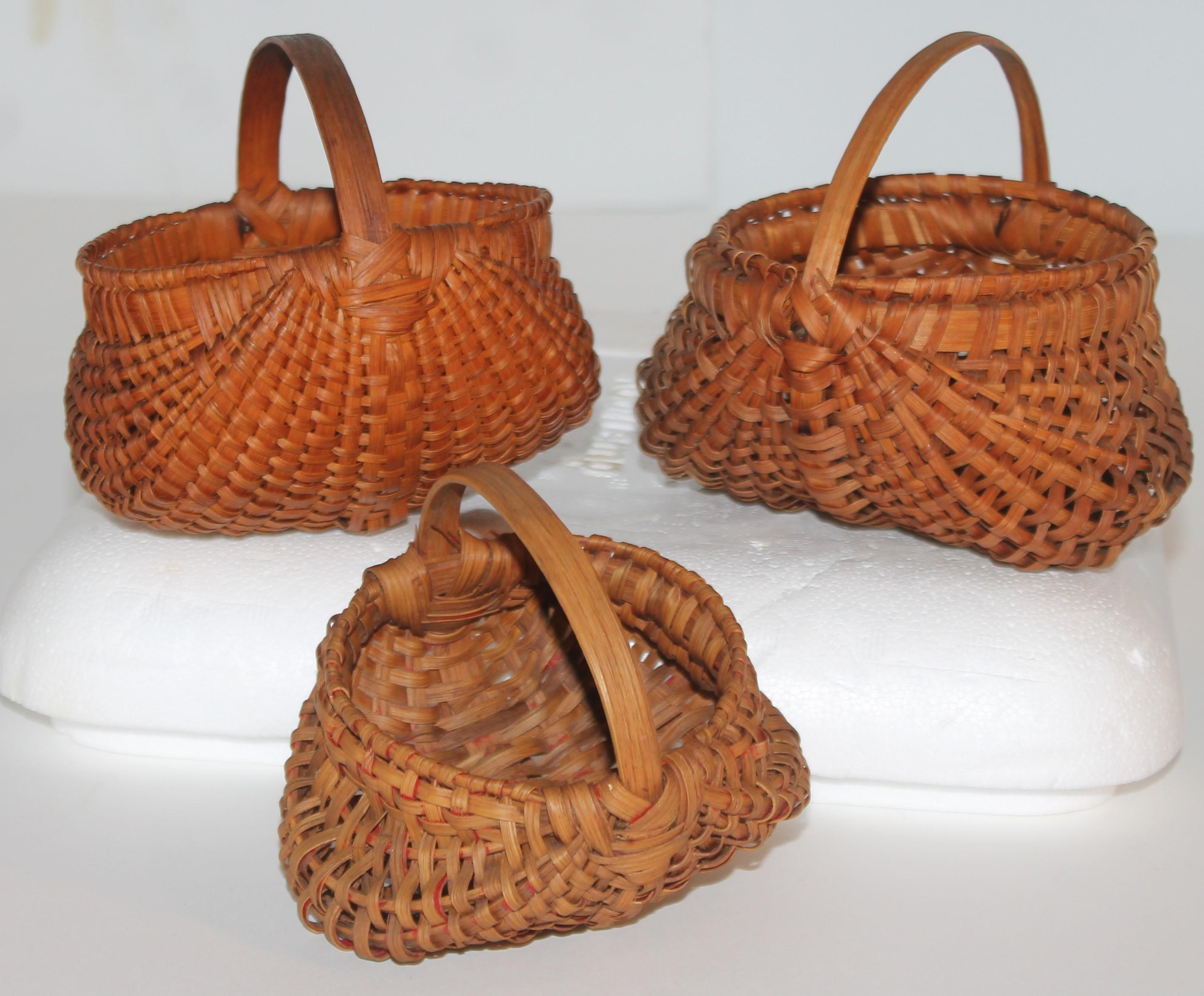 Collection of super rare miniature 19th C hiney or buttocks baskets in mint condition. These hand made and tightly woven baskets come from a folk art collection in Pennsylvania. Its rare to find one in such great condition and to find three is like