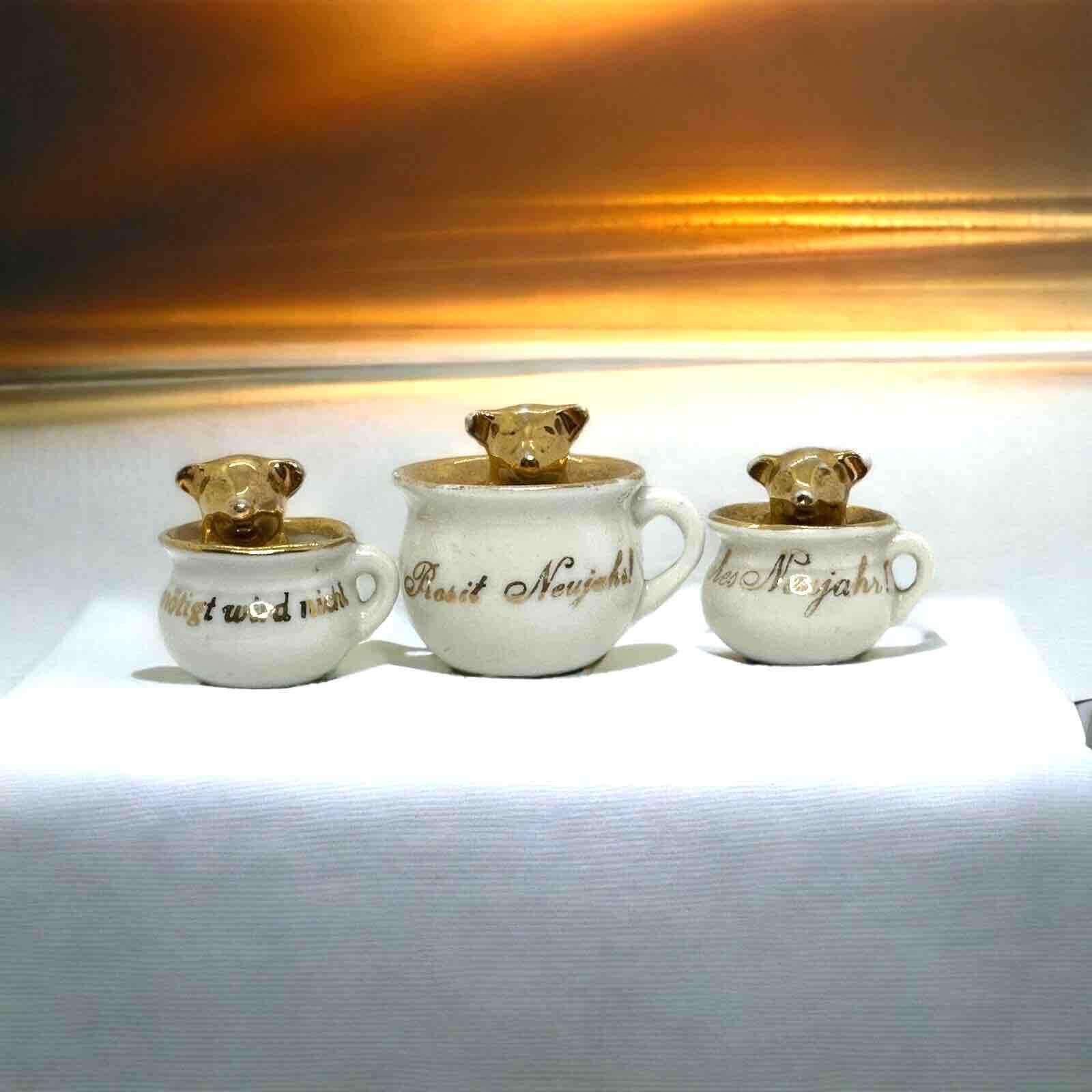 A beautiful collection of golden pig lucky charm figurines. Made from china porcelain. Such items are given away as good luck charms on New Year's Eve. Nice addition to your Christmas or New Year collection or decoration. It dates from the 1900s or