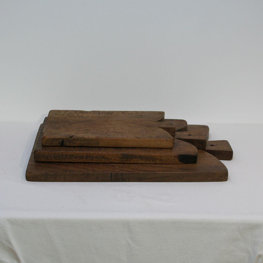 Beautiful small collection of three wooden chopping-cutting boards. Great statement on your counter-top.
France, circa 1850-1900. Weathered.
Measurement here below is of the largest chopping board.
