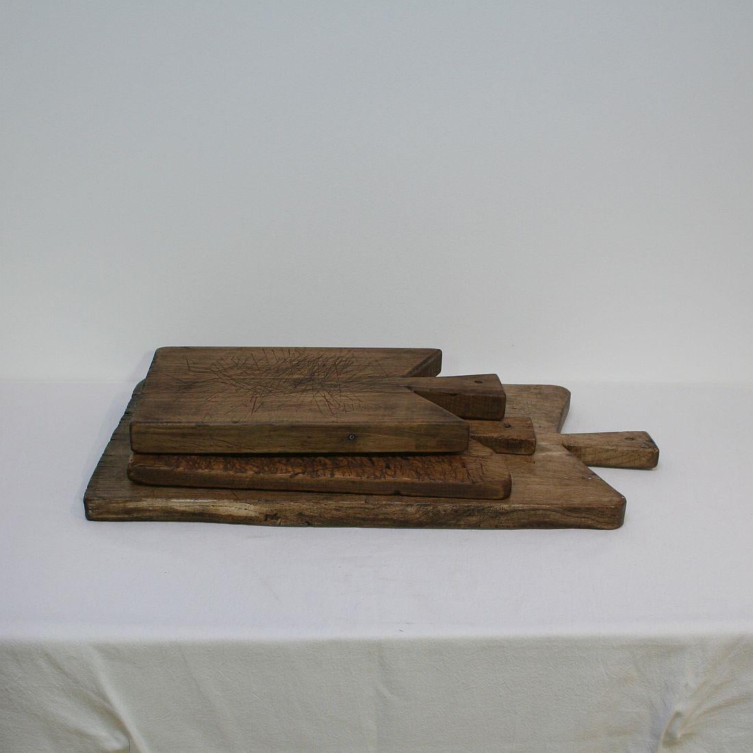 Beautiful small collection of three wooden chopping-cutting boards. Great statement on your counter-top
France, circa 1850-1900. Weathered.

 