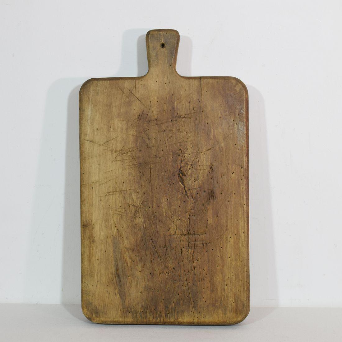 Beautiful small collection of three wooden chopping-cutting boards. Great statement on your counter-top,
France, circa 1850-1900. Weathered. Measures: H:40-50cm W:21-30cm D:3-5cm. Measurement here below of the largest cutting board. More pictures