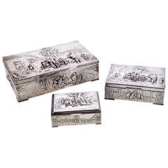 Collection of Three Silver Plate Cigarette Boxes Decorated with Genre Scenes