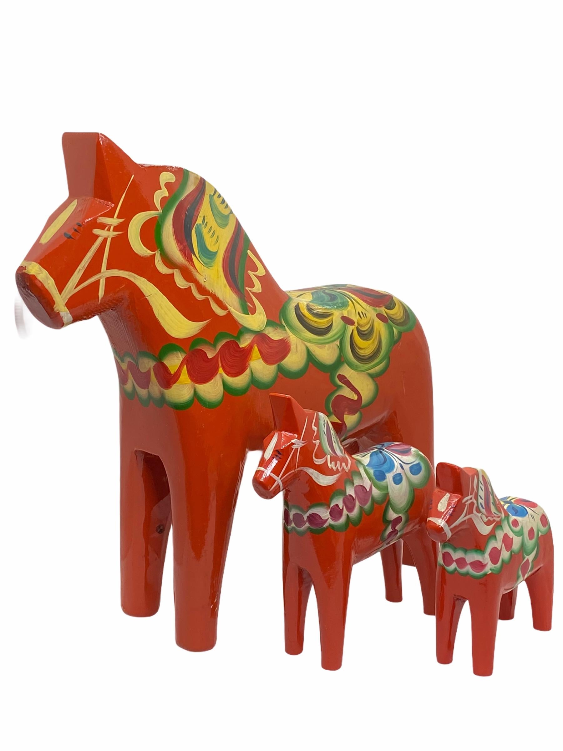 This offer is for a collection of three Swedish Dala Horses by Nils Olsson. These are hand carved painted wood. The large one is approximate 12 1/4