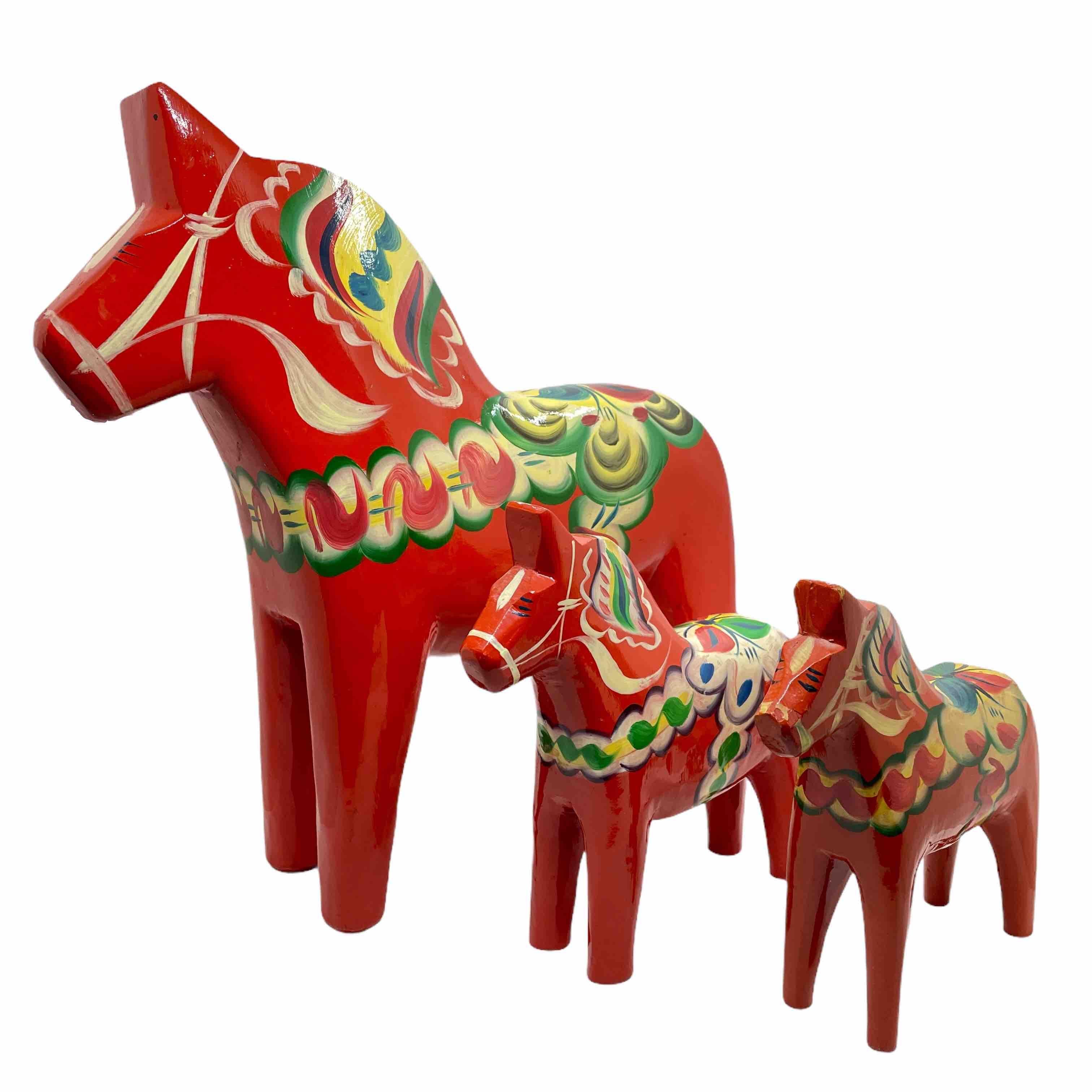 This offer is for a collection of three Swedish Dala Horses by Nils Olsson. These are hand carved painted wood. The large one is approximate 12 1/4