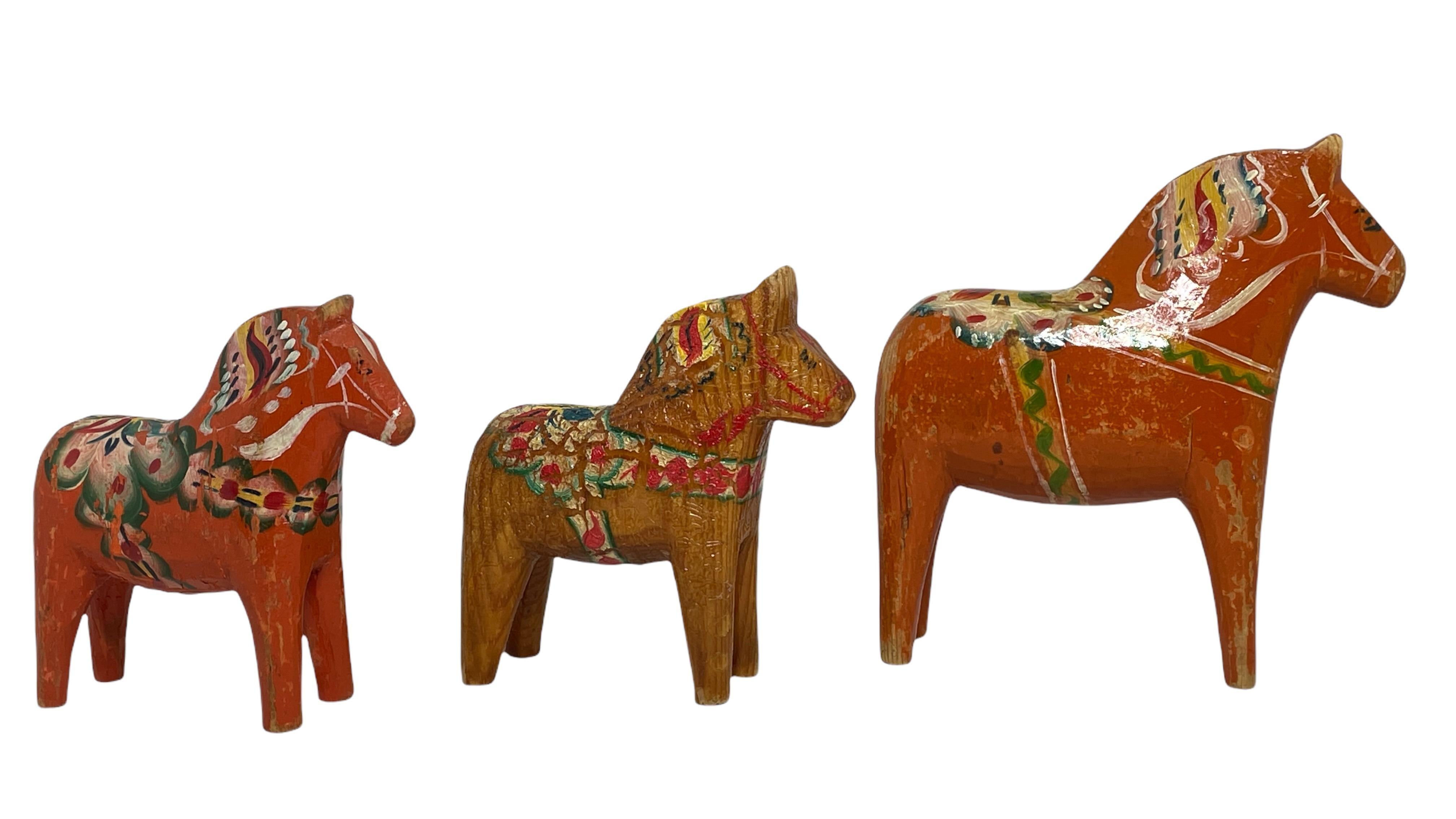 This offer is for a collection of three Swedish Dala Horses. These are hand carved painted wood. The larger one is approximate 5 1/8