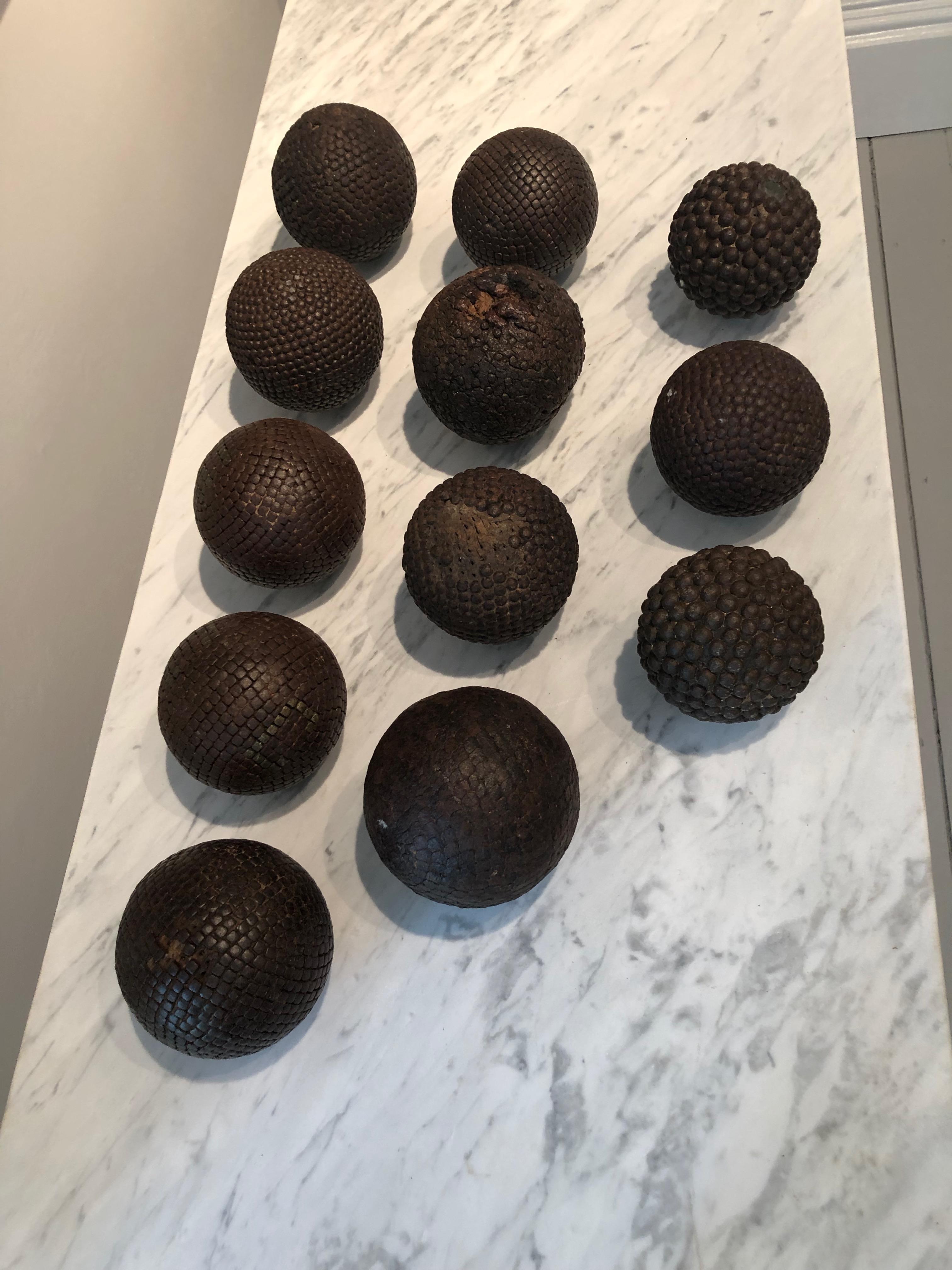 Boules are used to play Pétanque, the French equivalent of Boccé, and this collections is stunning. Made from wood (likely walnut) and iron studs and dating to the 1840s, the set comprises two different sizes, nine larger and two smaller boules, and