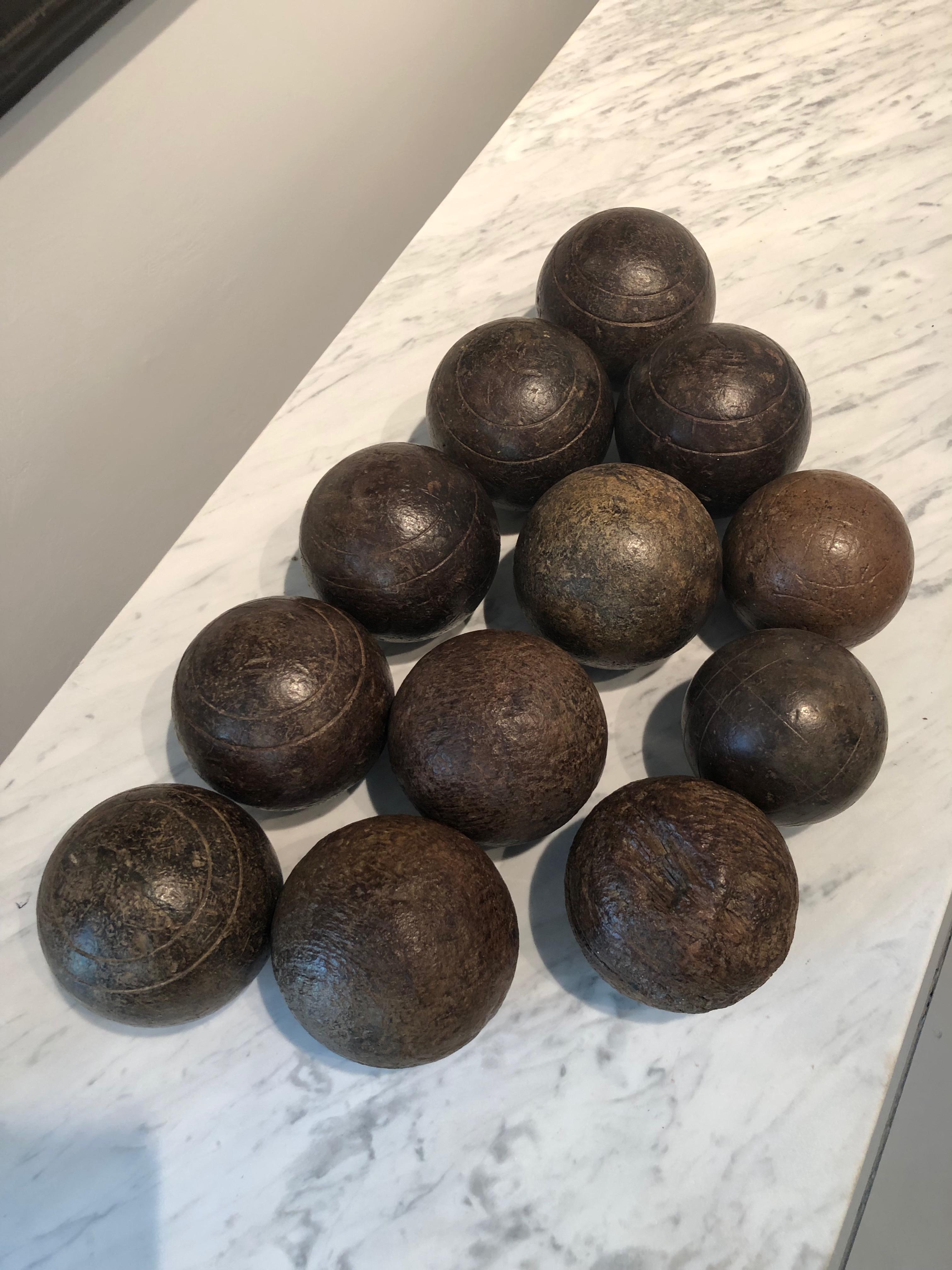 Boules are used to play Pétanque, the French equivalent of Boccé and this set is beautiful. Made from walnut and dating to the 1870s, the set comprises two different sizes, ten larger and two smaller boules some incised with circular detailing and