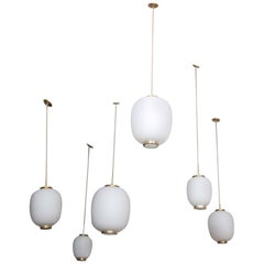 Collection of Twelve Opaline Glass and Brass Ceiling Fixtures for Lyfa, 1950s