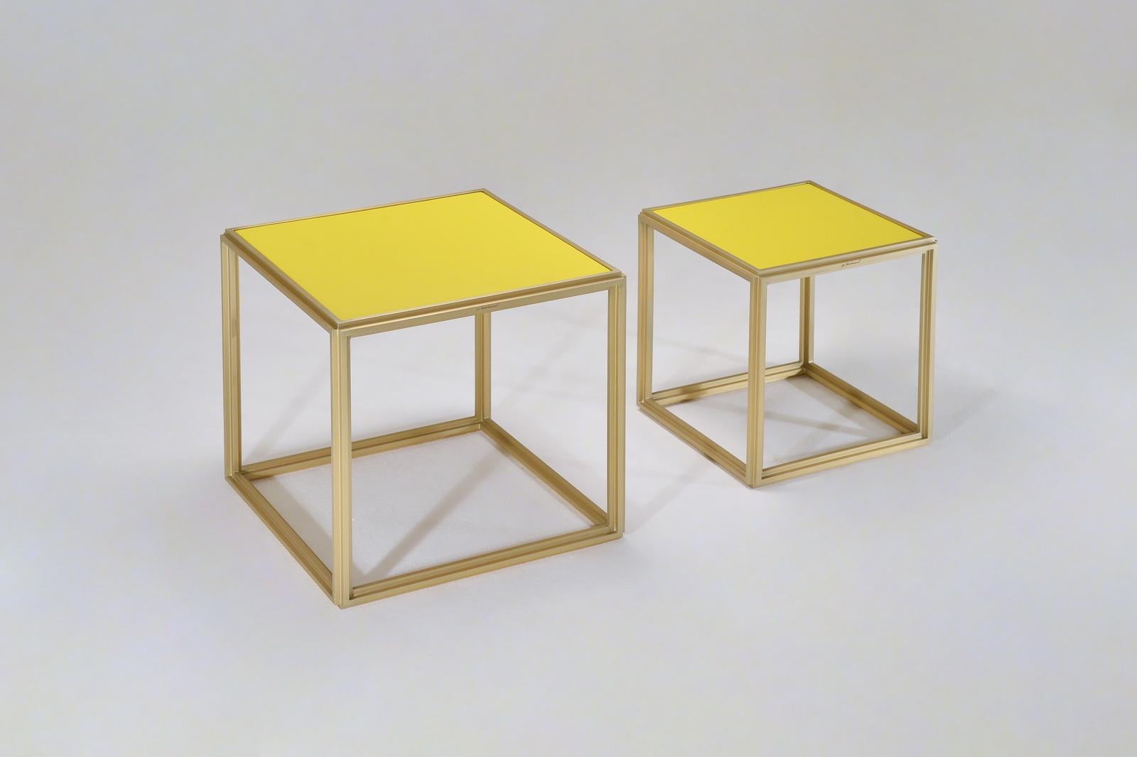 Model: P.Tendercool-BLTs
Frame: Golden sand
Top: Wood top covered in yellow leather
Dimensions: PT8 42 x 42 x 41 cm.
(W x D x H) PT8 16.54 x 16.54 x 16.14 inch

Available now - one of a kind 

Collection of two Brass Low Tables, with wood tops