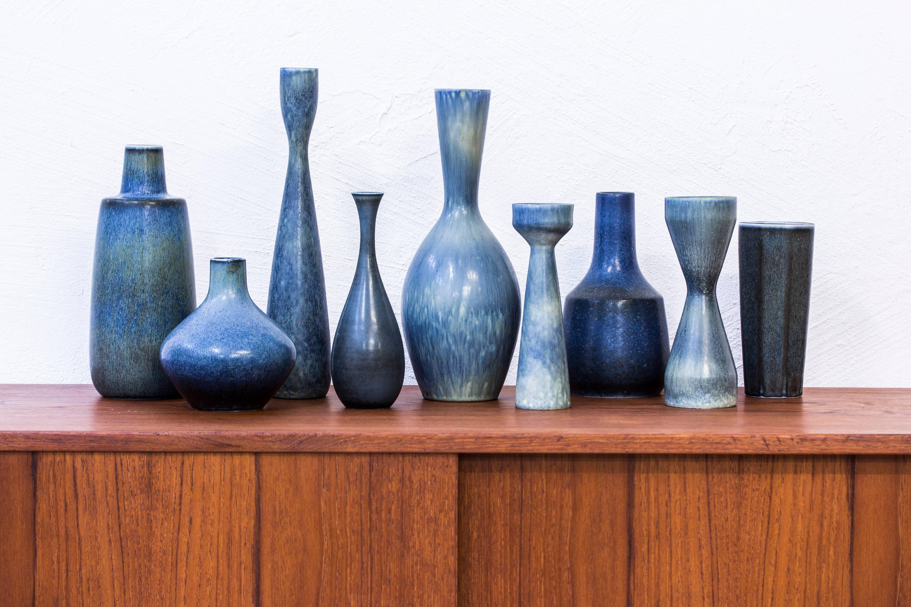 Collection of nine vases designed by Carl Harry Stålhane. Produced by Rörstrand during the 1950s. Made from stoneware with glazes in varying blue and green tones. All signed and all in excellent condition with light patina and age related wear.