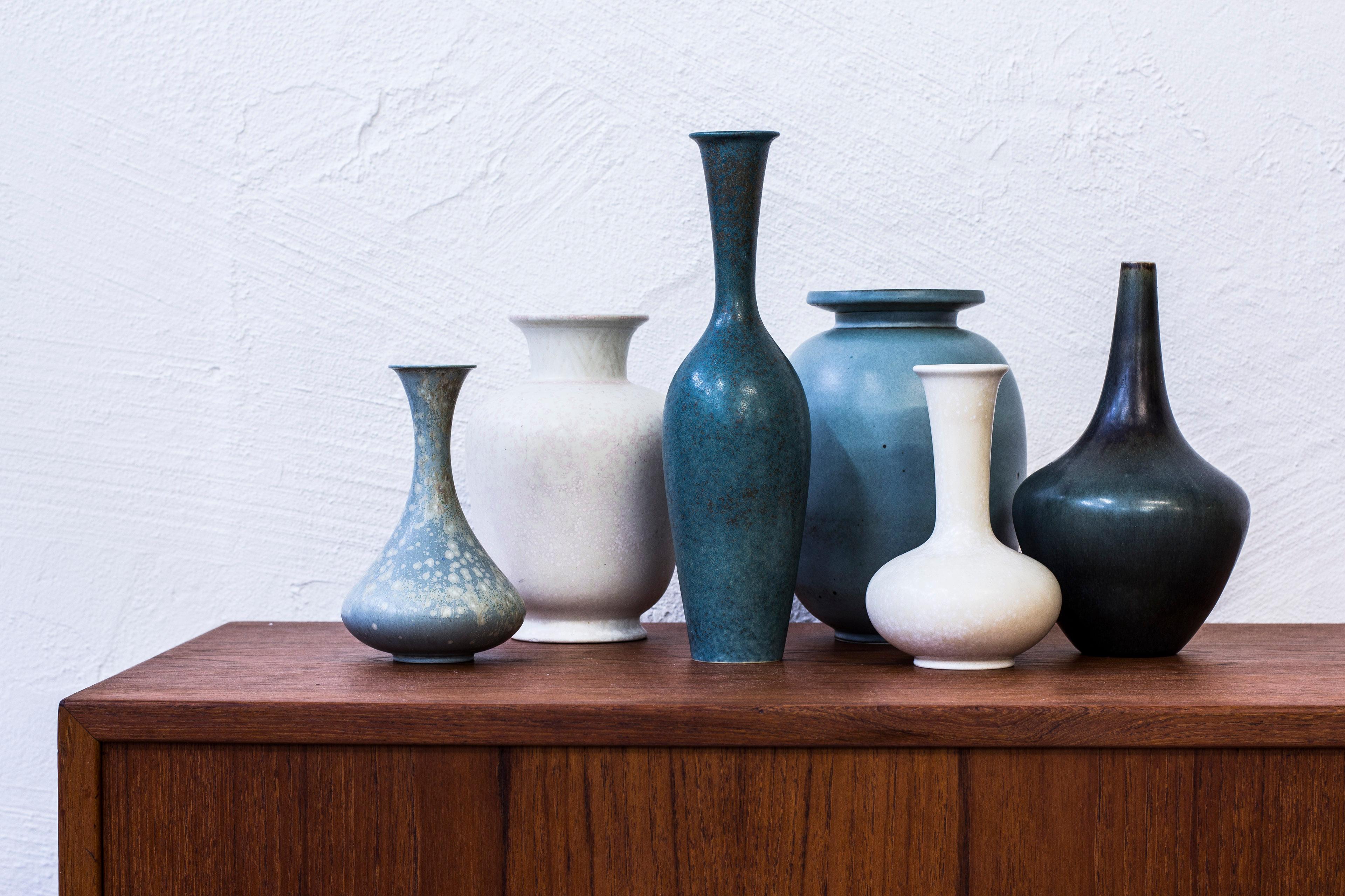 Collection of six vases designed by Gunnar Nylund. Handmade in Sweden by Rörstrand during the 1950s. Various shapes and shifting glazes. Excellent condition to all vases without damages. All vases signed by Rörstrand, Model number, makers mark and