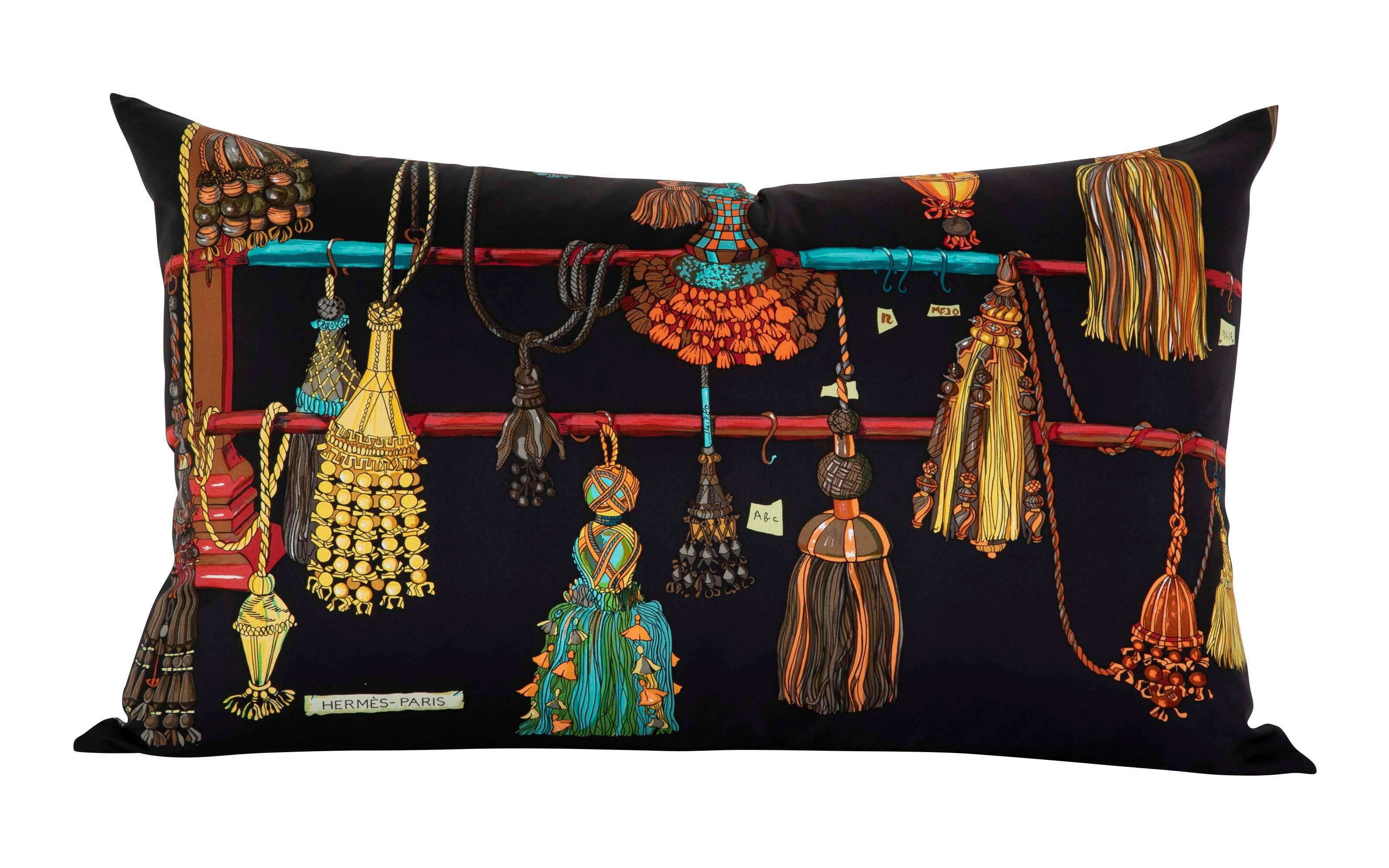 A collection of seven pillows made from vintage silk Hermes scarfs. Sold separately.

 