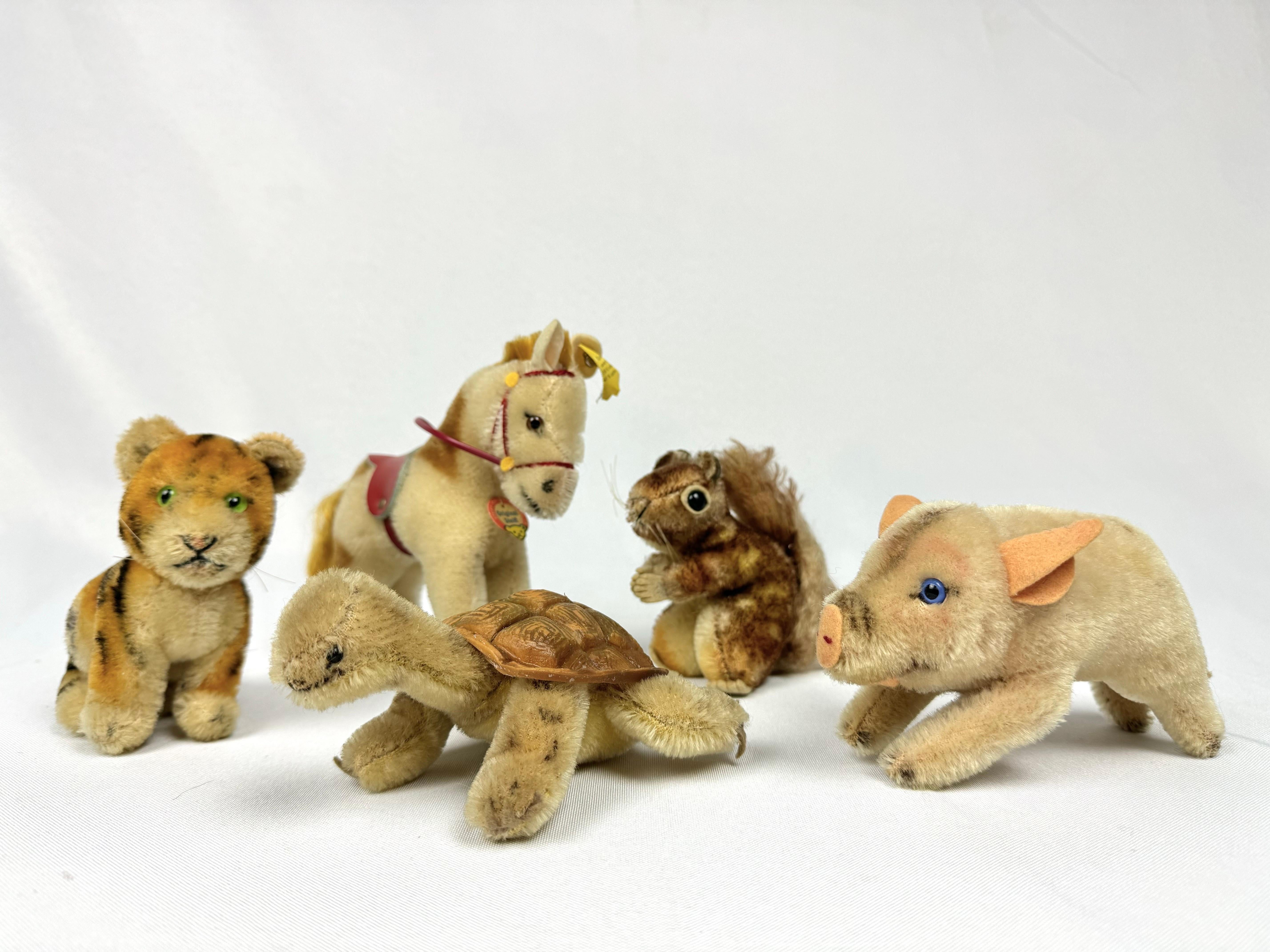Collection of Vintage Steiff Animals. The set of 5 animals consists of a pig, horse, turtle, tiger, and squirrel. Perfect for that collector. Only the horse has the original ear tag and neck tag, All the others were obviously well played with.
