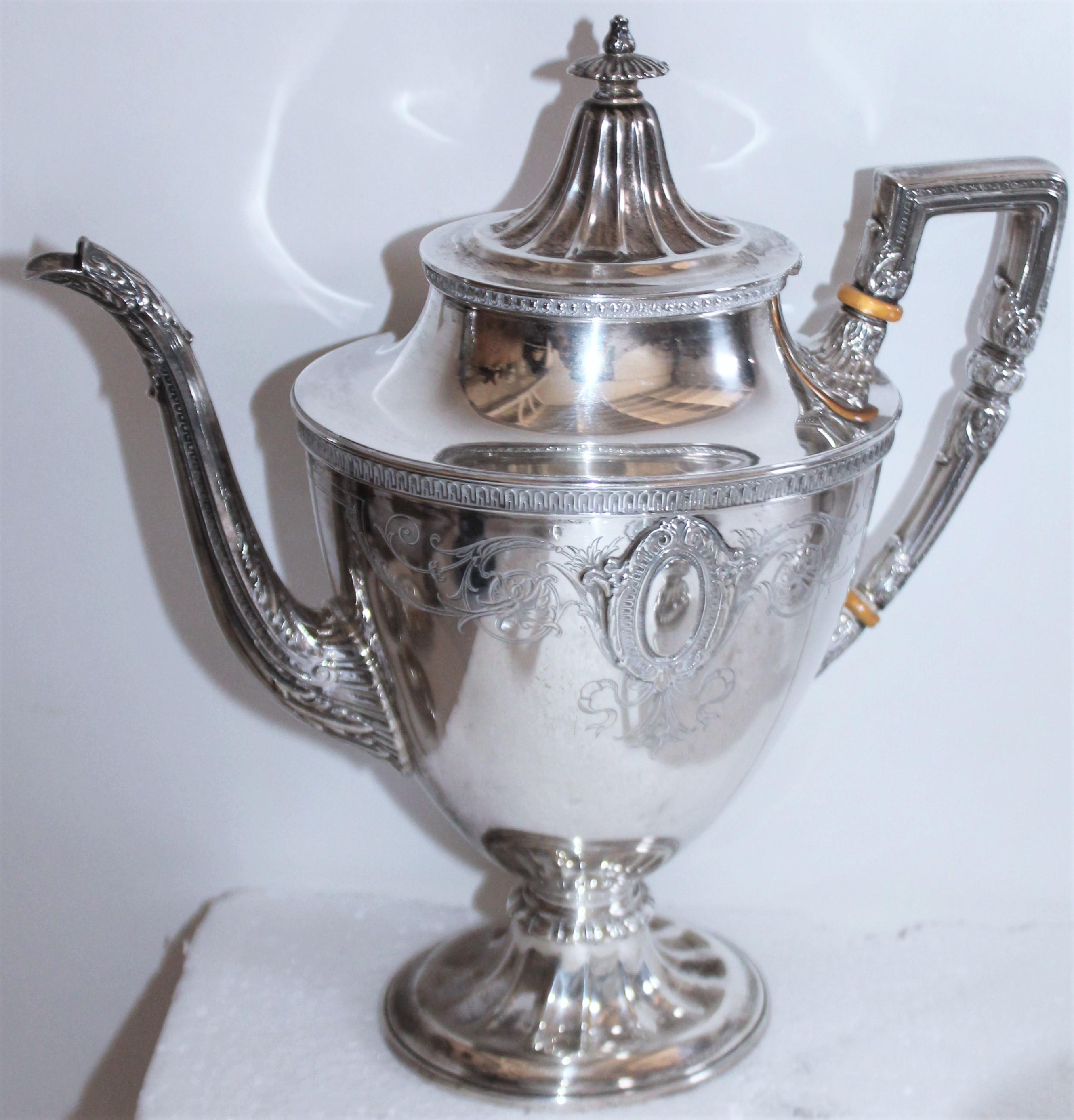 Collection of five Wallace sterling silver tea or coffee. Coffee pot / tea pot, creamer and sugar. Sugar cube bowl on feet.

Measures: Coffee pot - 10 wide x 11 high x 5 deep
Tea pot - 11.5 wide x 8.5 high 5 deep 
Creamer -5.5 wide x 6 high x