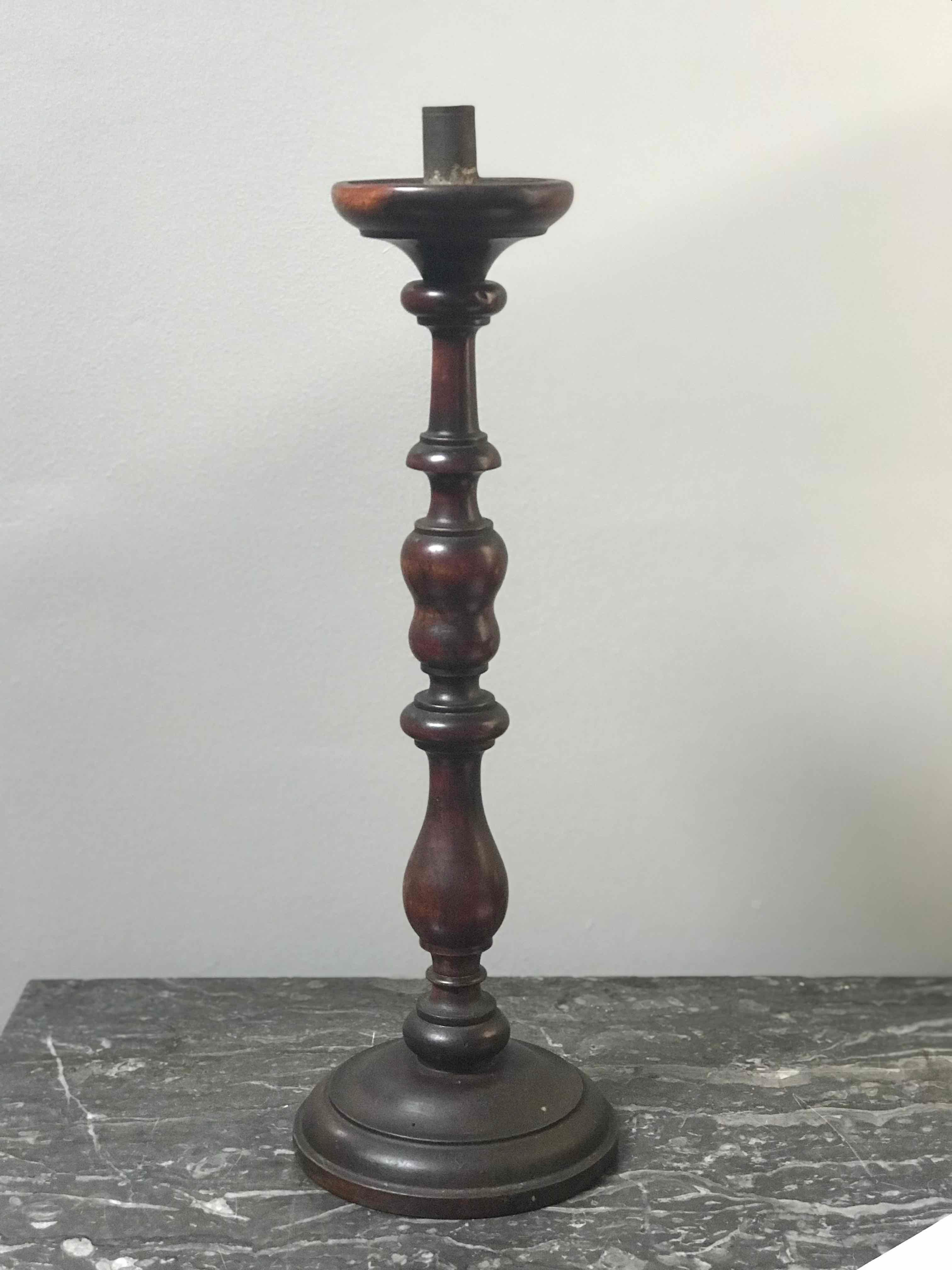 Walnut turned candlestick from 1860s France. 