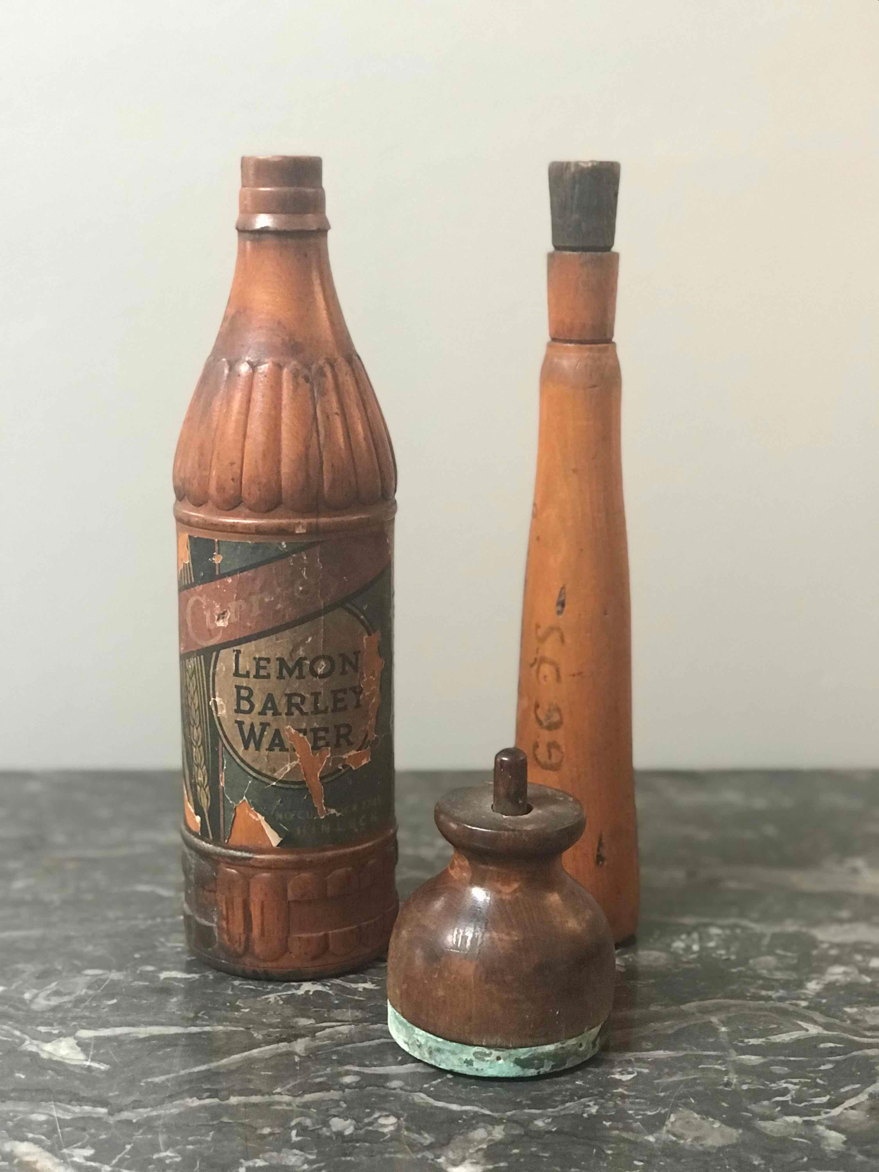 Collection of early 20th century wooden bottle molds from the John Lamb and Co. Glassworks in Castlelford, West Yorkshire. 25 piece set (24 bottles and 1 stamp)