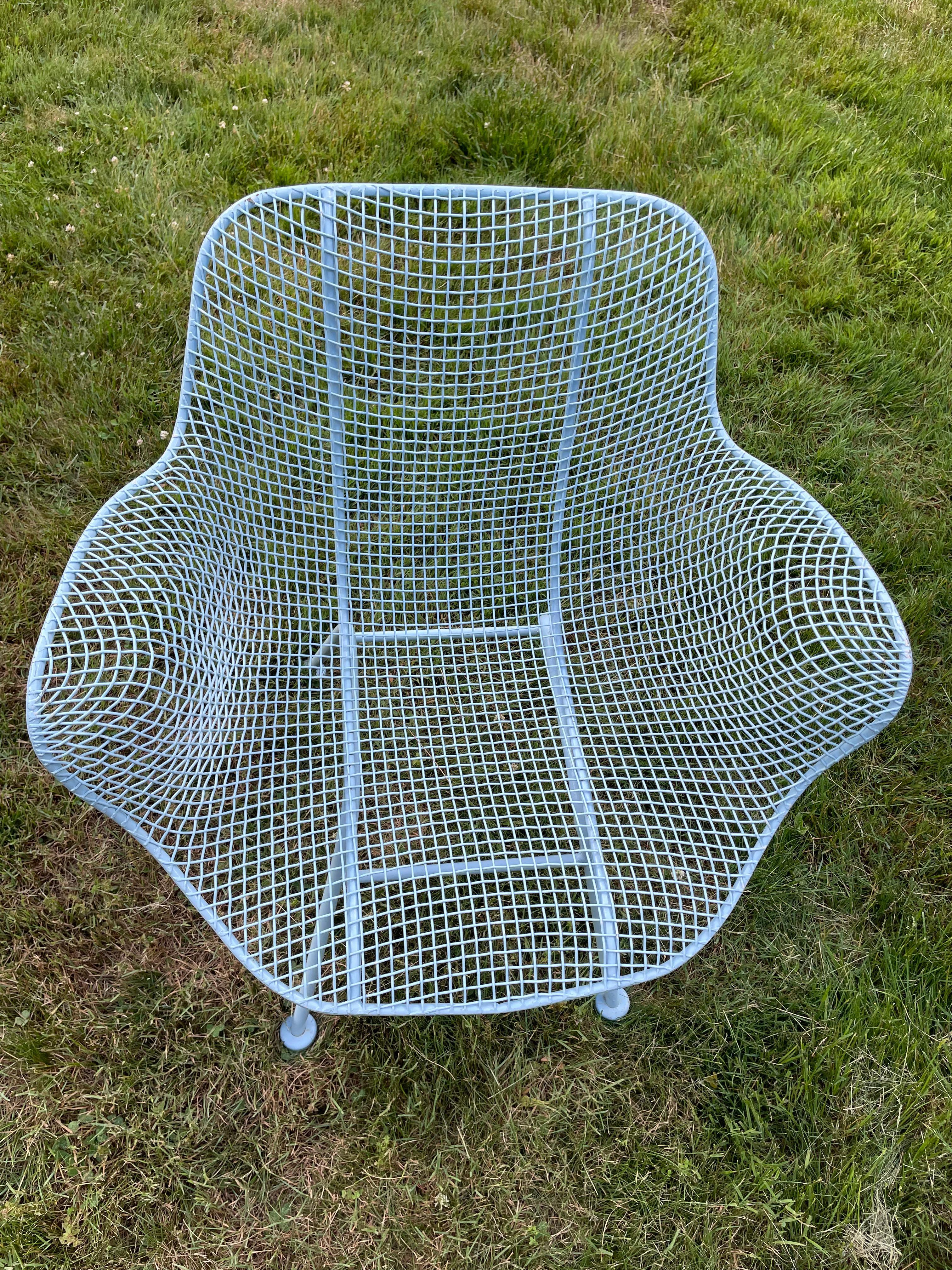 Wonderful and hard-to-find color of circa 1950's Russell Woodard's iconic Sculptura series outdoor chairs, and cocktail table. This iconic wrought iron and steel mesh grouping from Russell Woodard's iconic Sculptura series is beautiful and classic,