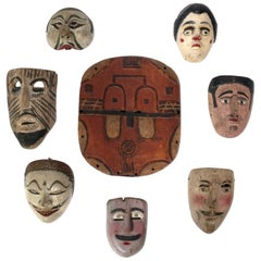 Retro Collection of Worldwide Traveler's Hand Carved Folk Art Masks